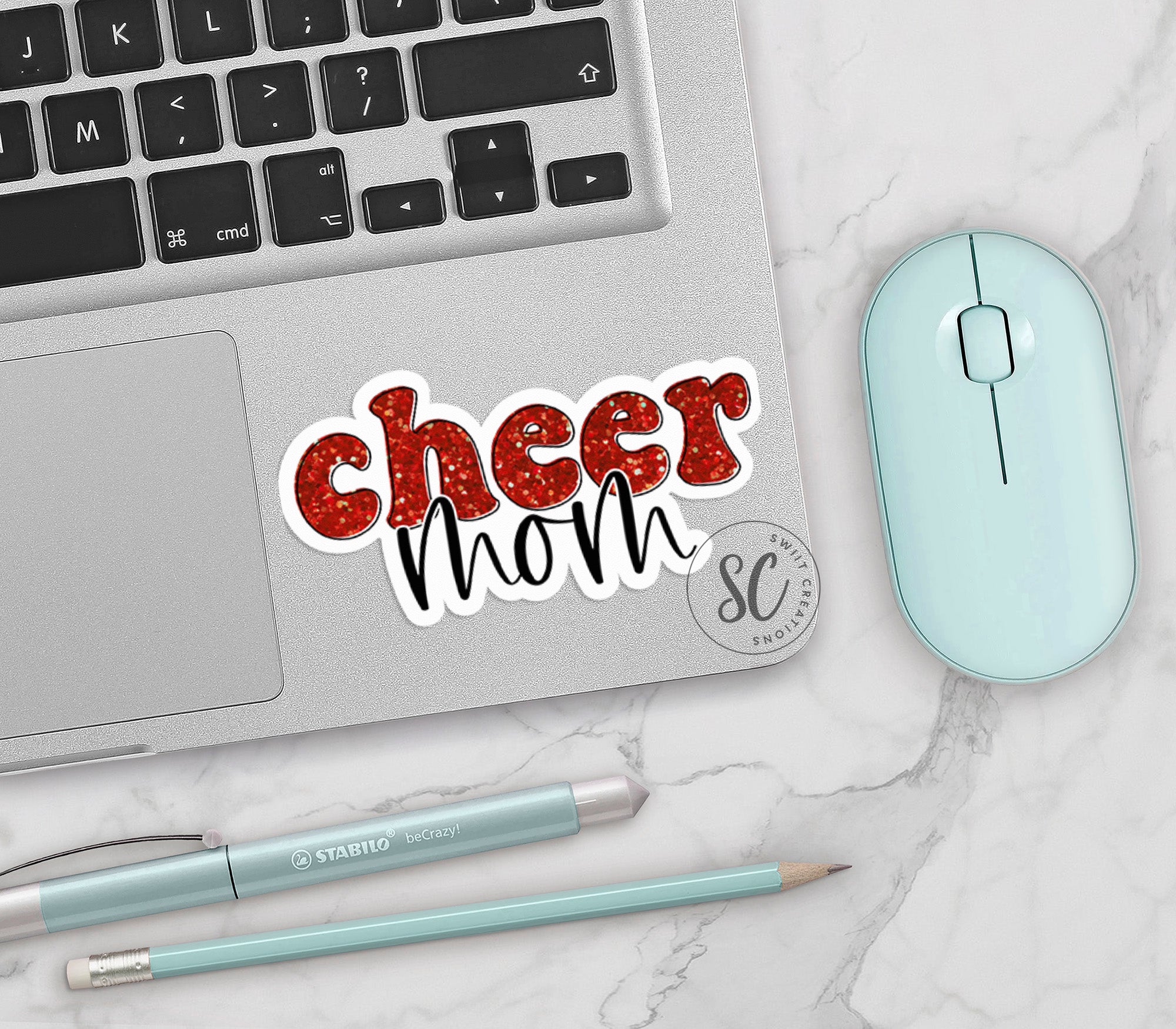 a laptop with a sticker that says cheer mom