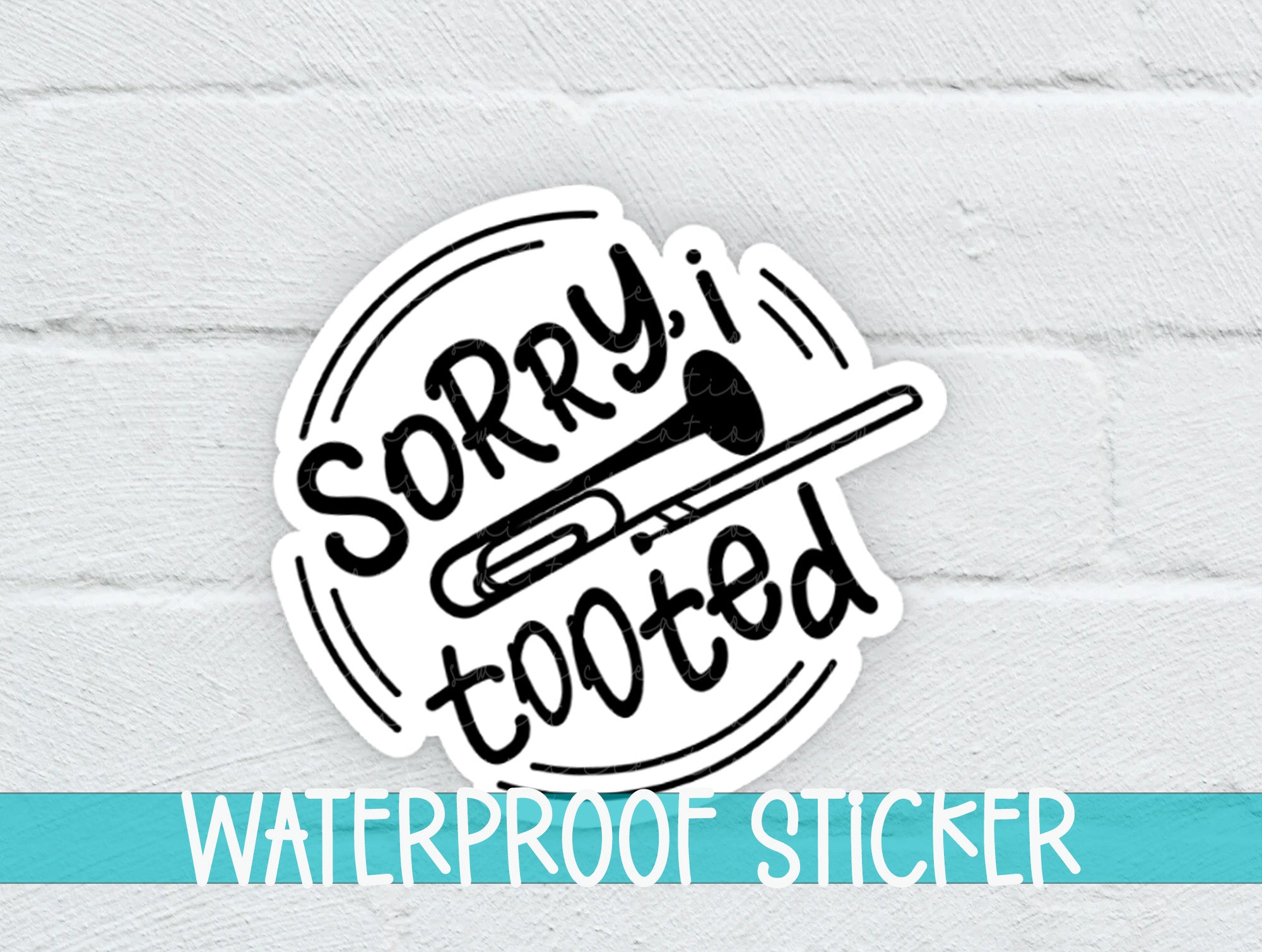 a white brick wall with a sticker that says sorry i looked