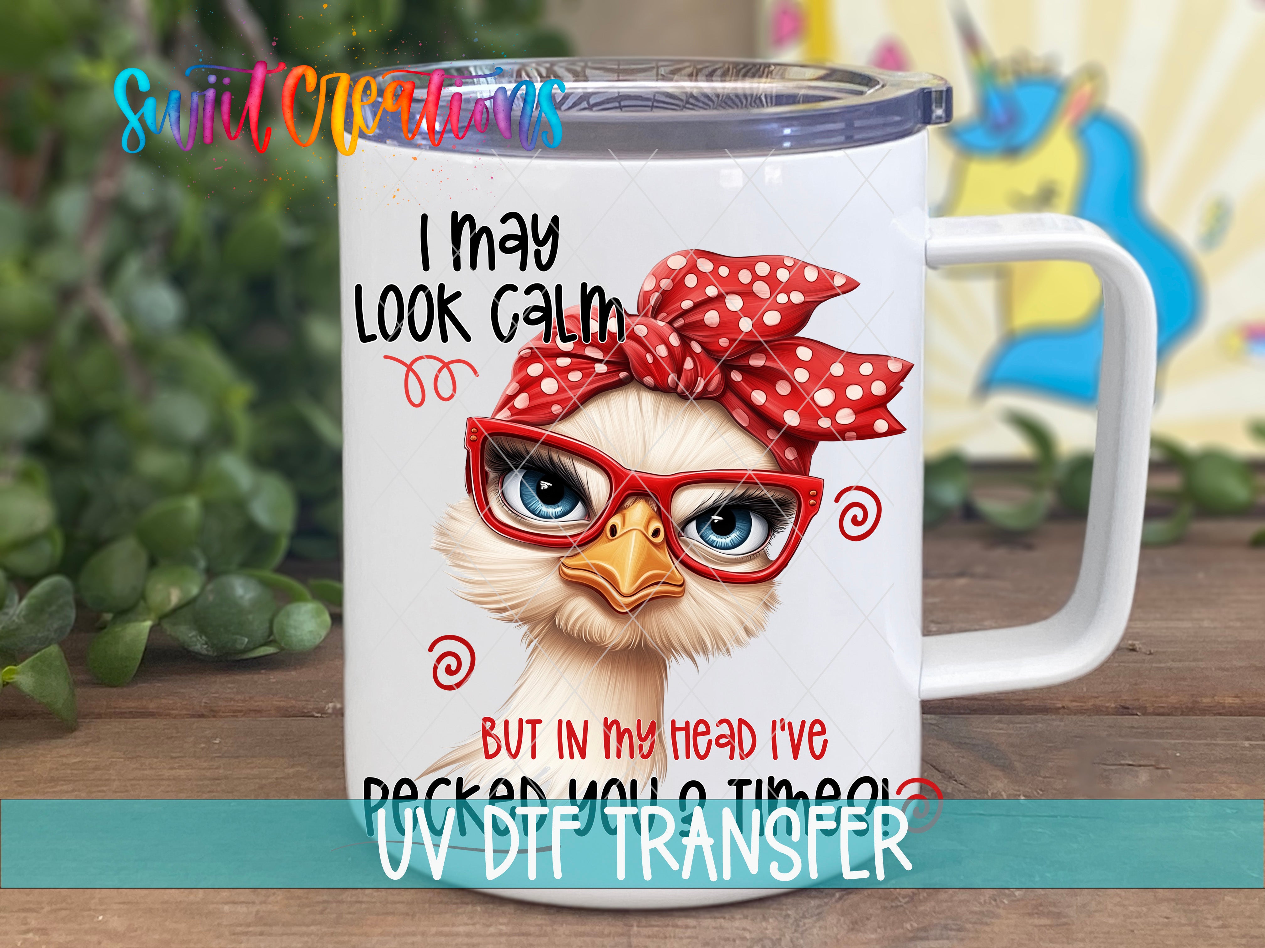A white mug with a cartoon image of a bird wearing red glasses and a red polka dot headband. The mug has a text overlay that says "I may look calm, but in my head I've packed my suitcase".