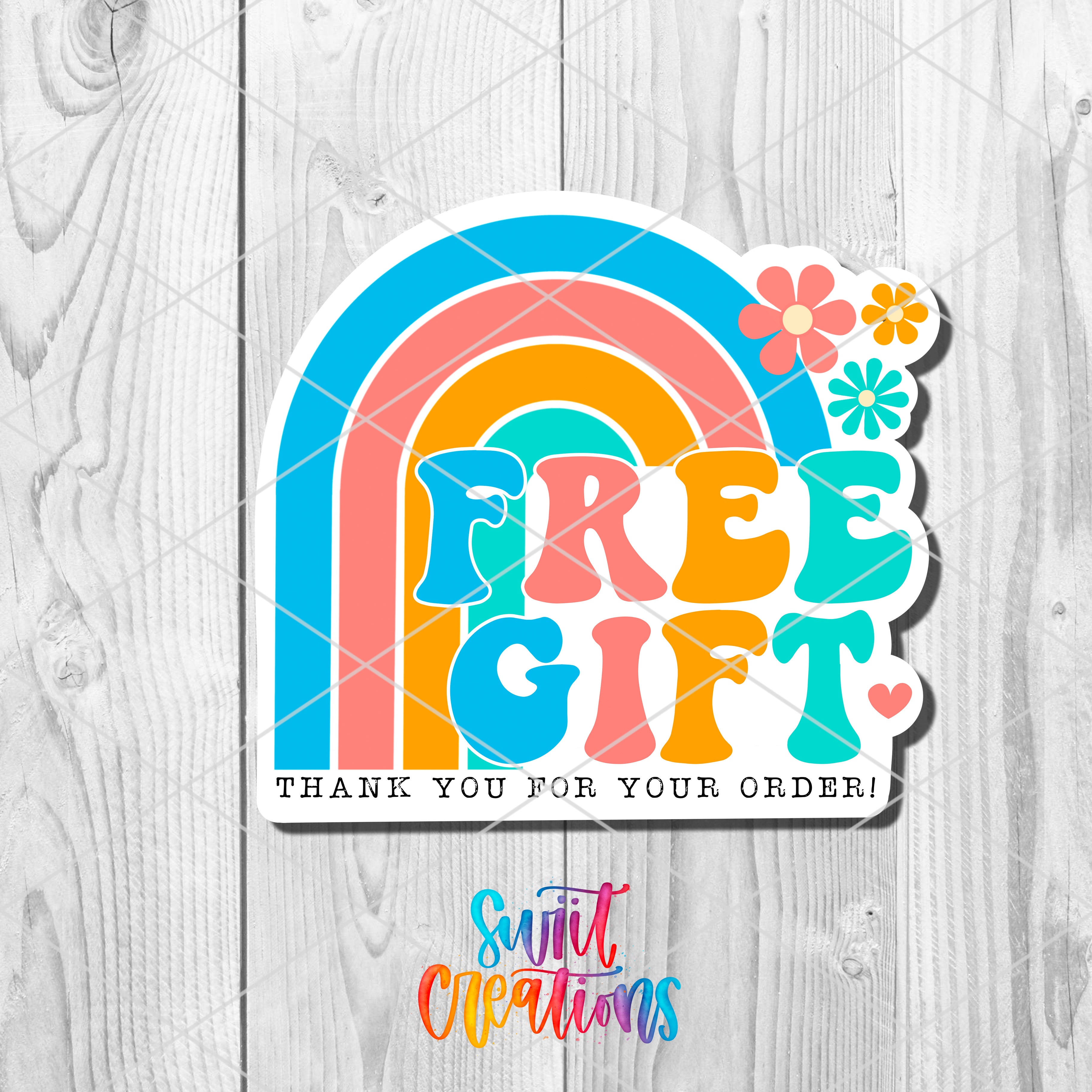 a sticker with the words free gift on it