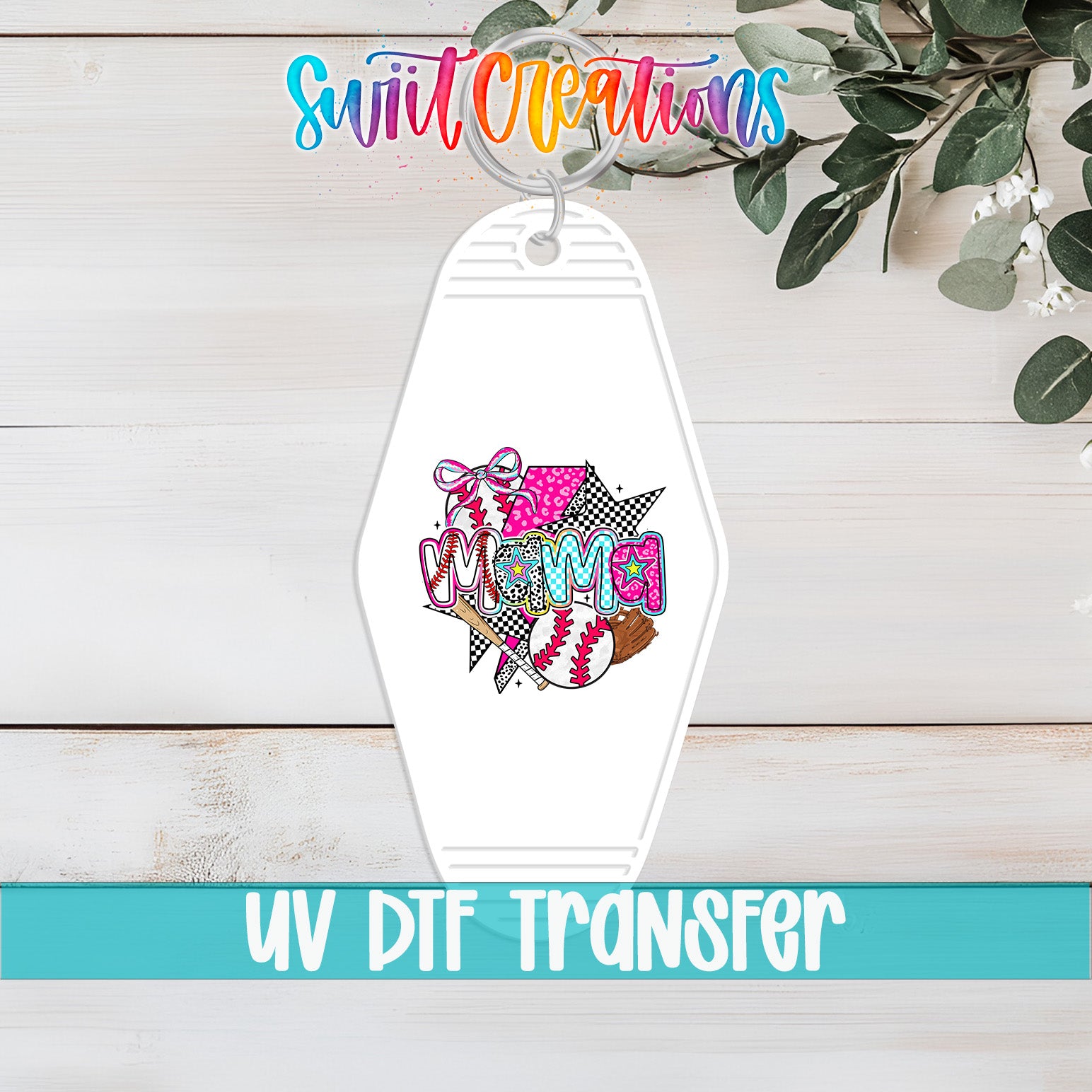 A keychain with a colorful graphic design and text, placed on a wooden surface with greenery in the background.