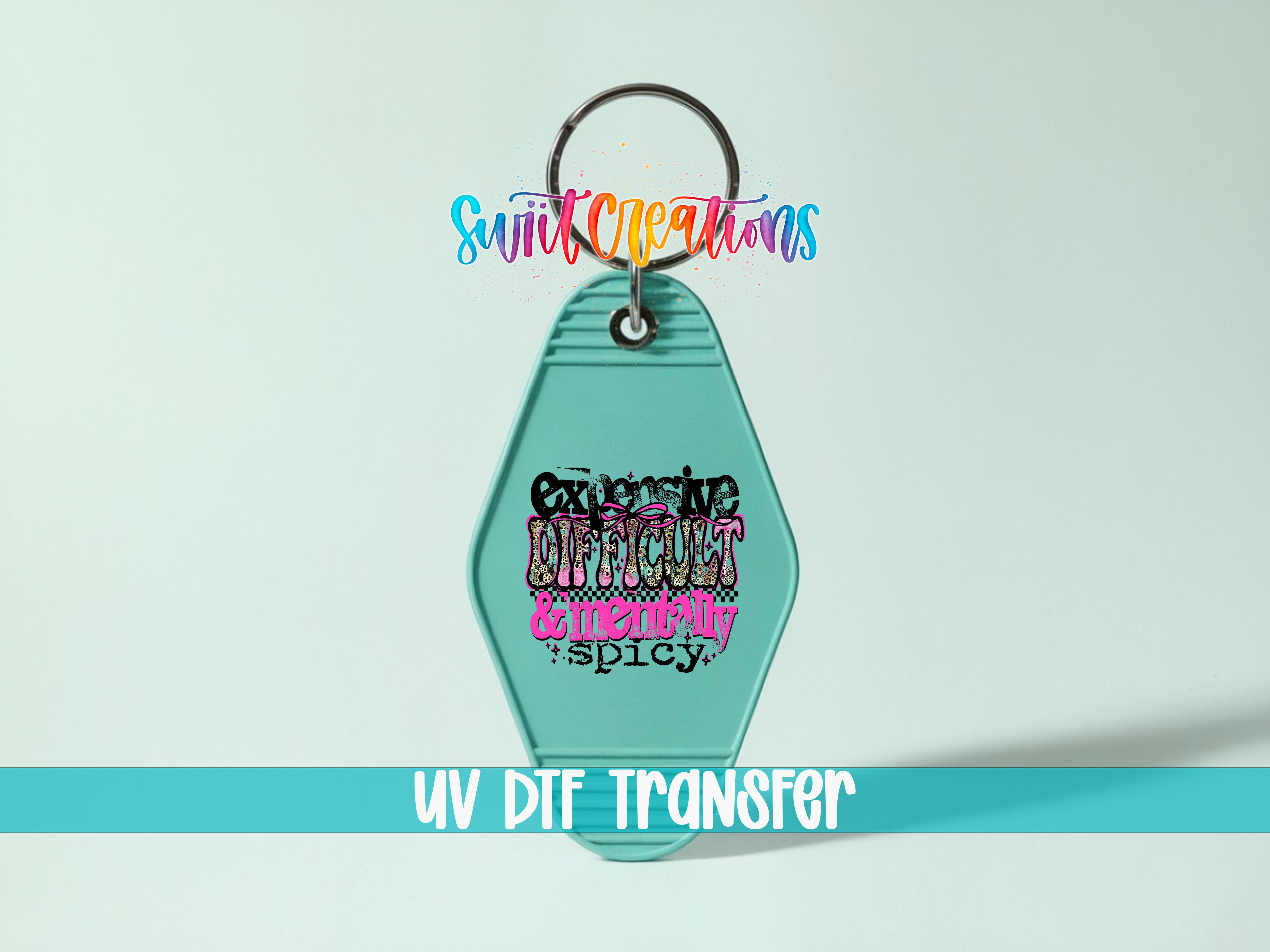A keychain with a colorful design and text on it, along with a UV DIF transfer label.