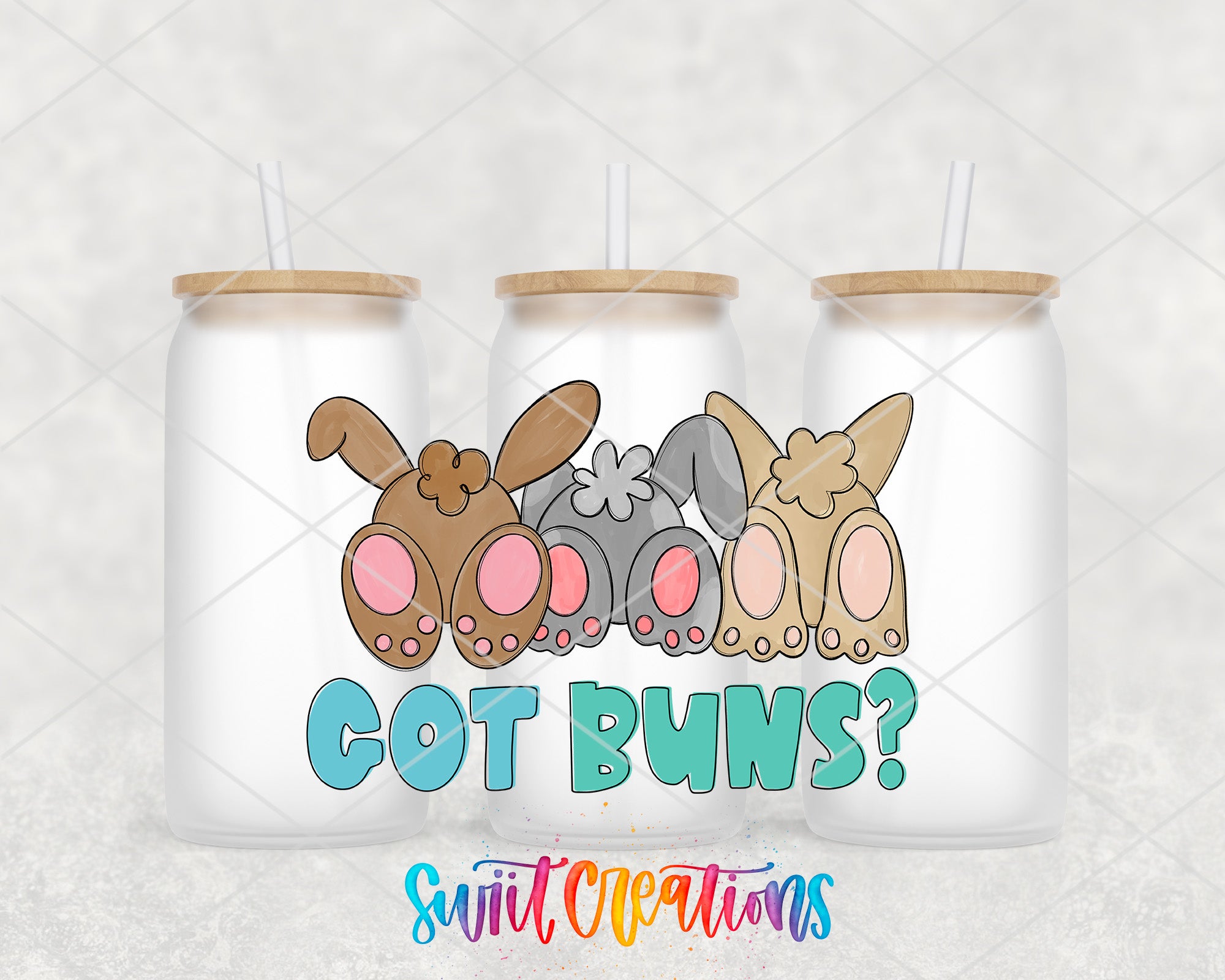 A trio of white tumblers with straws, each featuring a cartoon rabbit head and the text "GOT BUNS?" in a playful, colorful style.