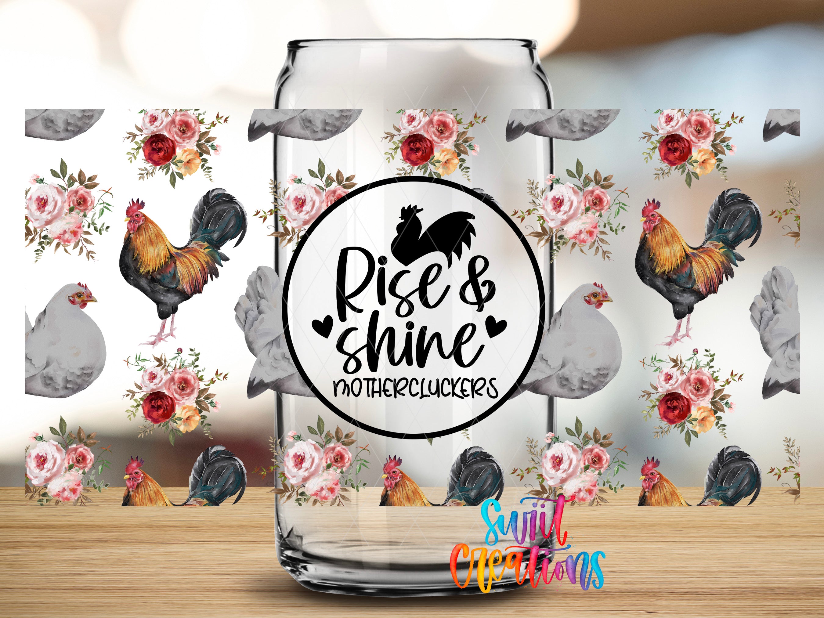 a glass jar with a floral pattern and a black and white text design on it.