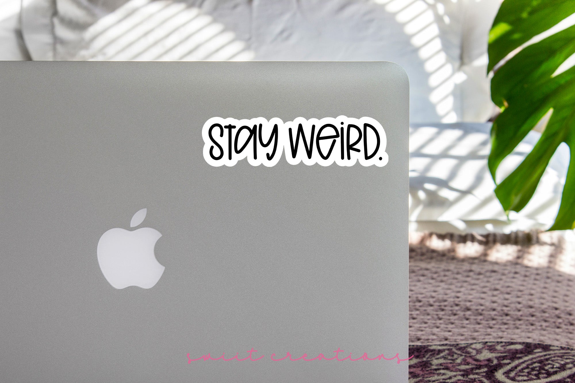 a laptop computer sitting on top of a table