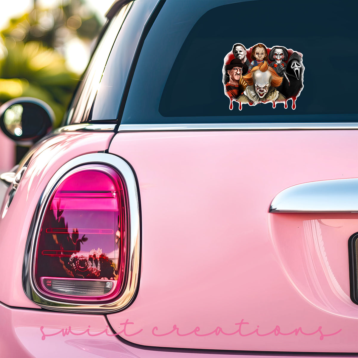 a pink car with a couple of stickers on it