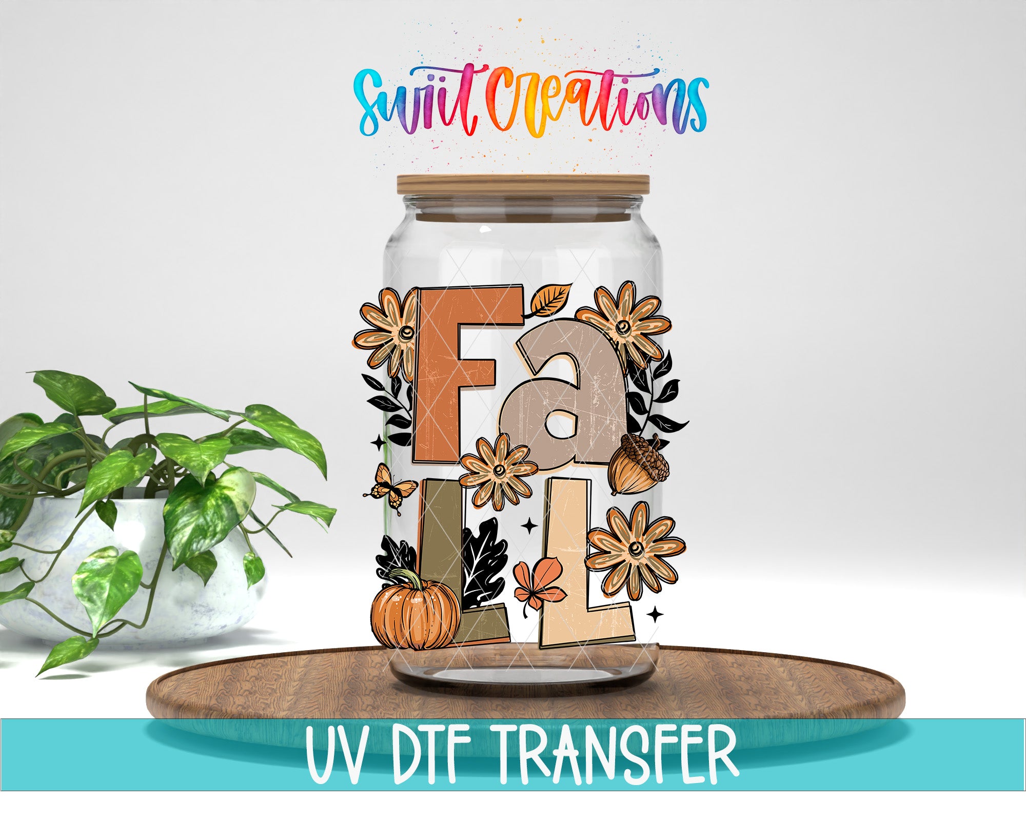 A glass jar with a fall-themed design, including flowers, leaves, and a pumpkin, is placed on a wooden surface.