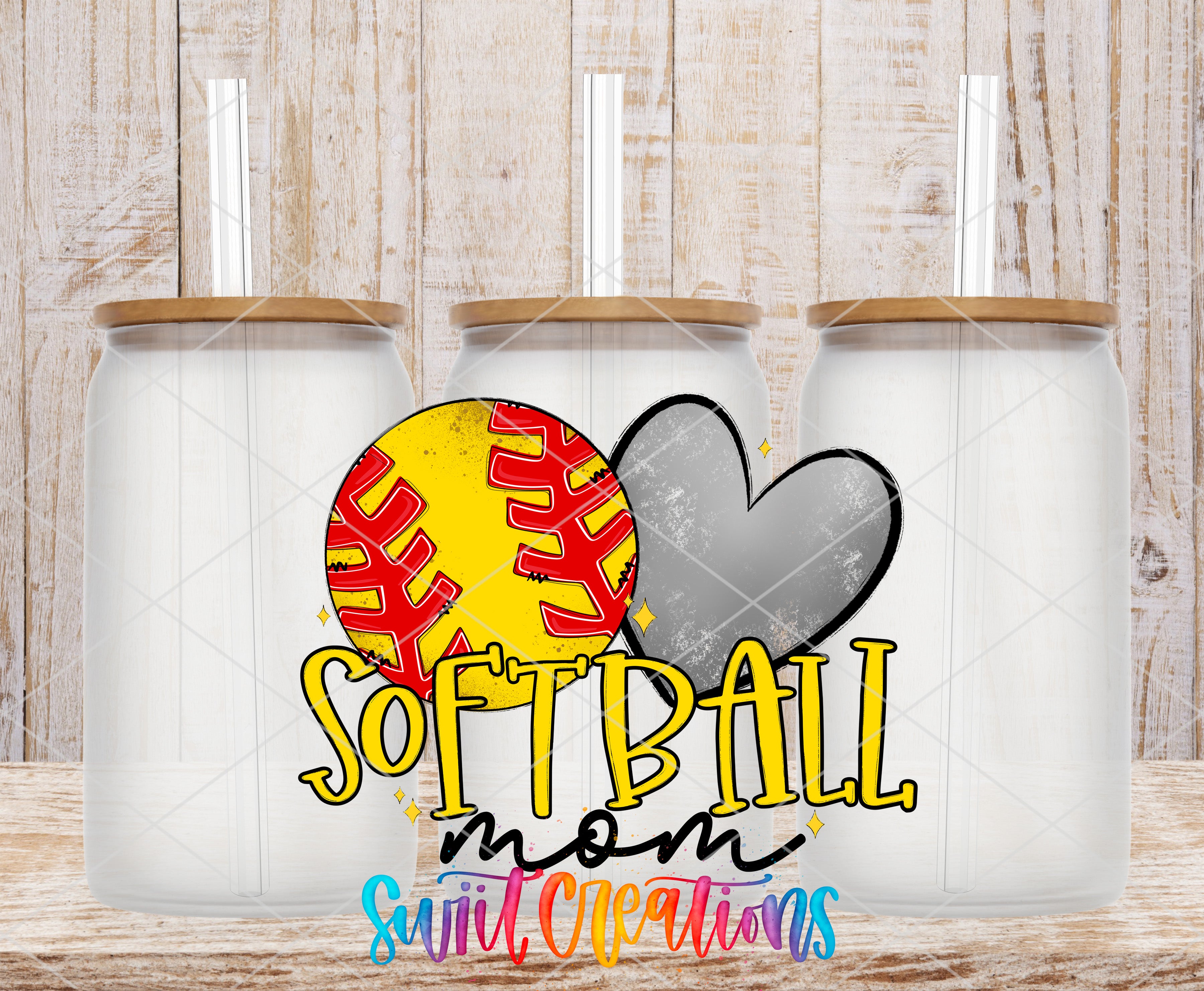 three glass jars with lids, each containing a straw, arranged in a row against a wooden background. The jars are labeled "Softball mom" and "Swift Creations", suggesting they are related to softball or sports-related items.