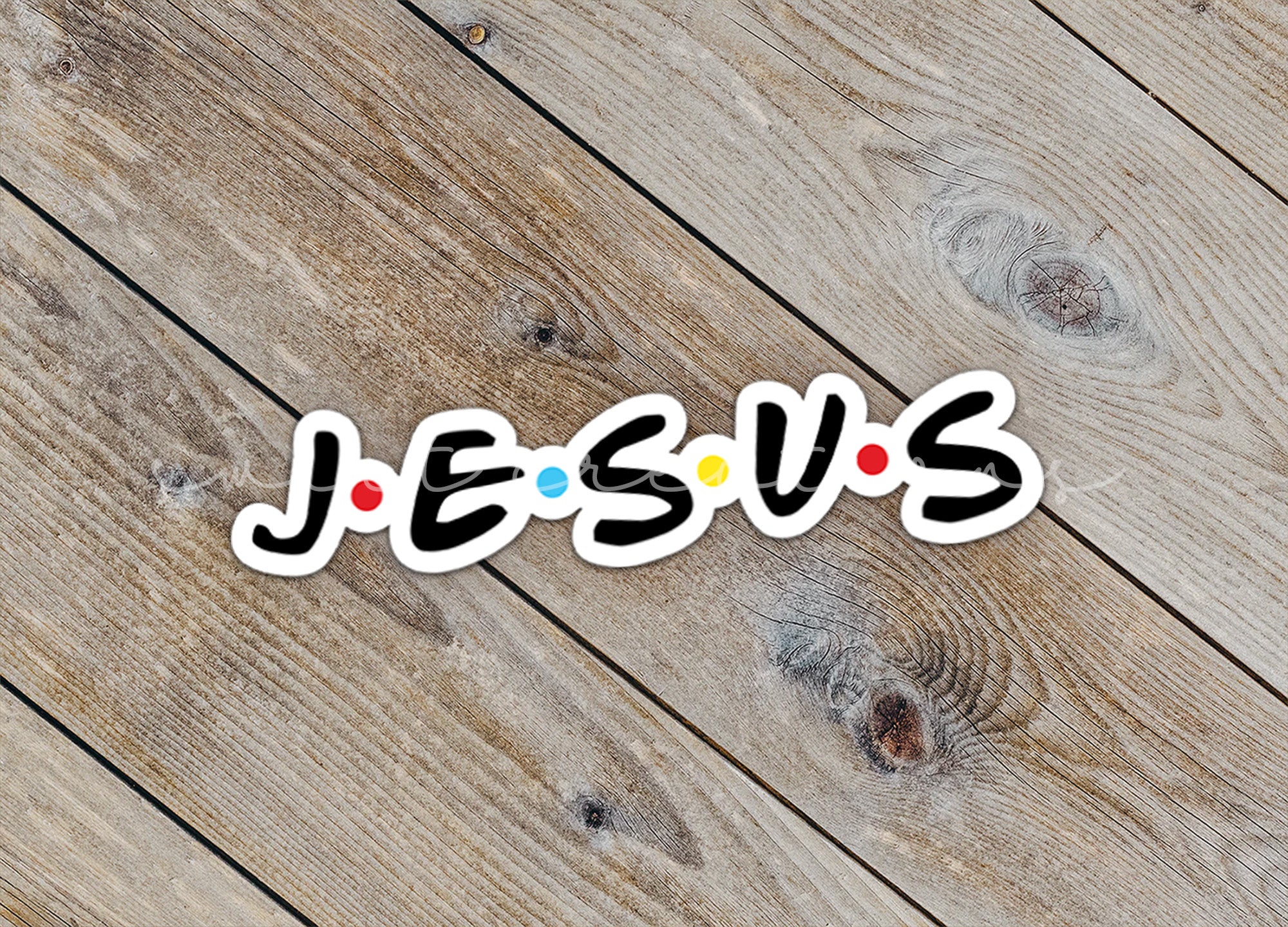 the word jesus spelled out on a wooden surface