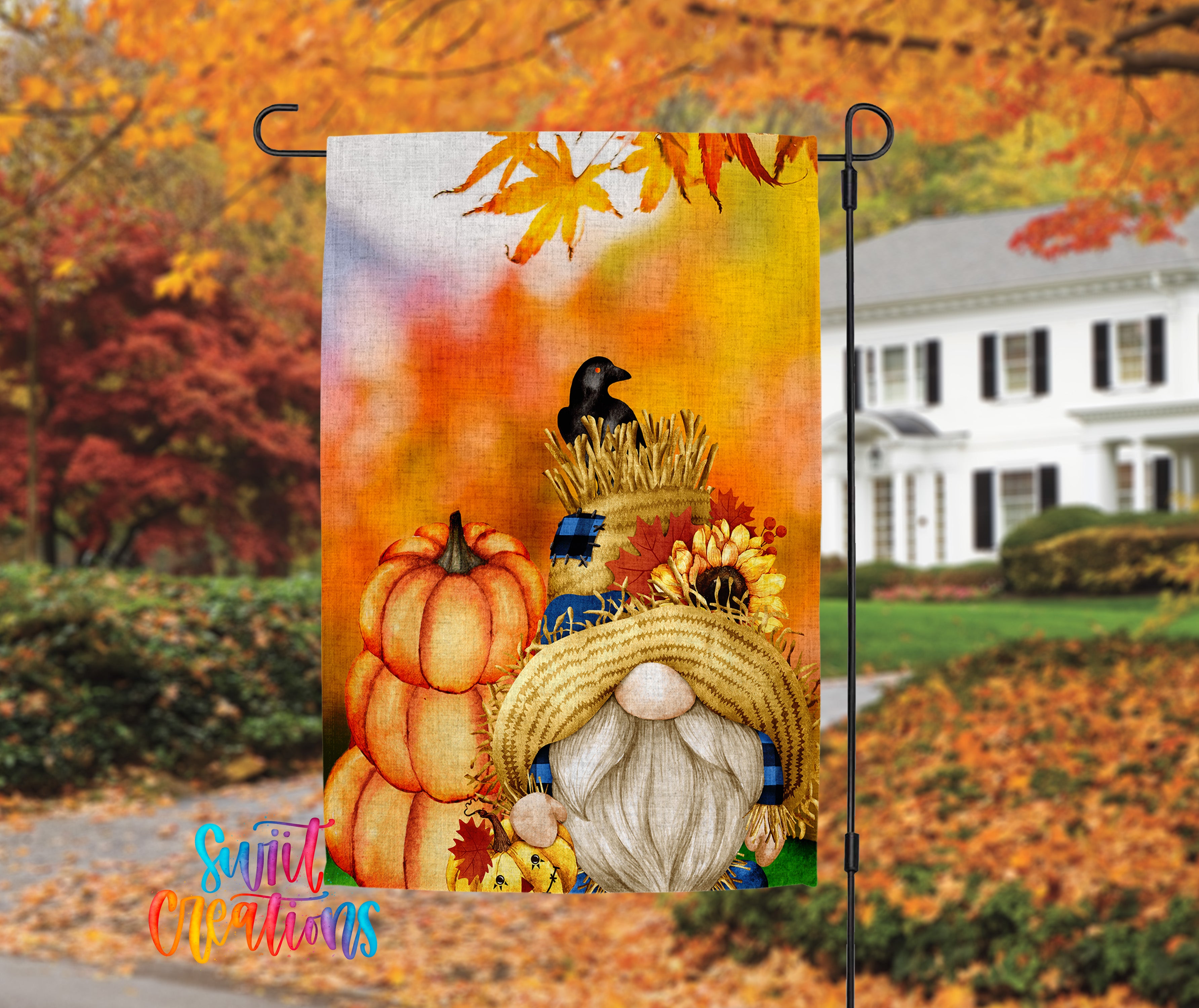 A colorful autumn-themed garden flag featuring a gnome wearing a straw hat and hat, surrounded by pumpkins, sunflowers, and a black crow.