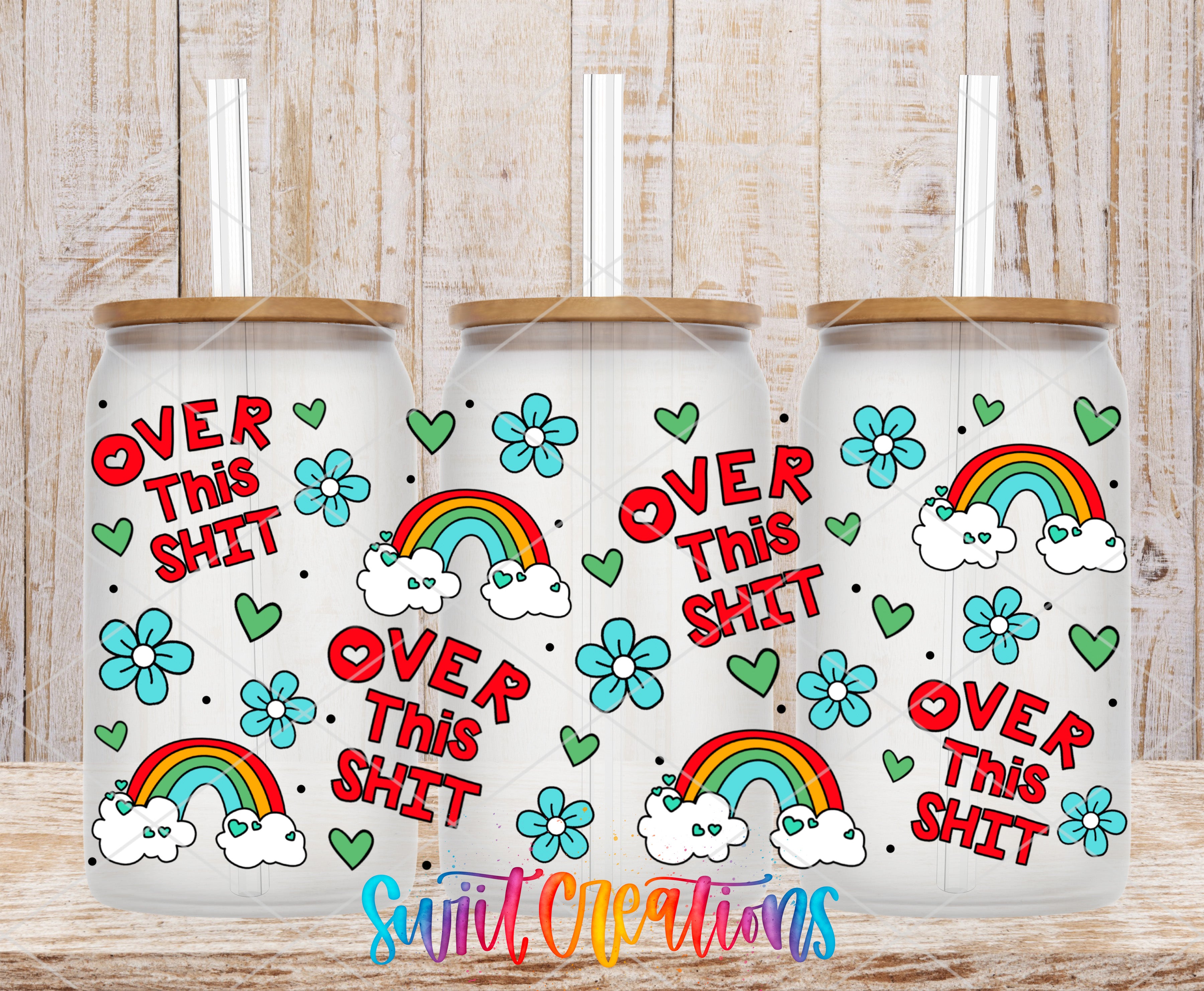 three white tumblers with colorful designs and text on them.