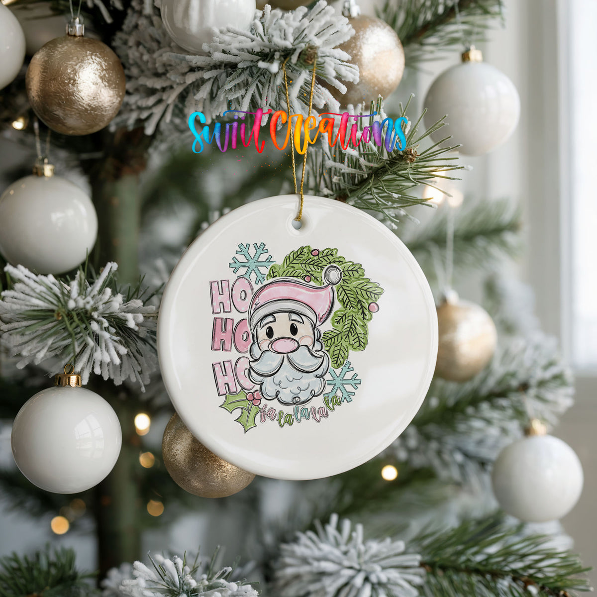 A white ceramic ornament with a Santa Claus design hangs from a Christmas tree, surrounded by white and gold ornaments.