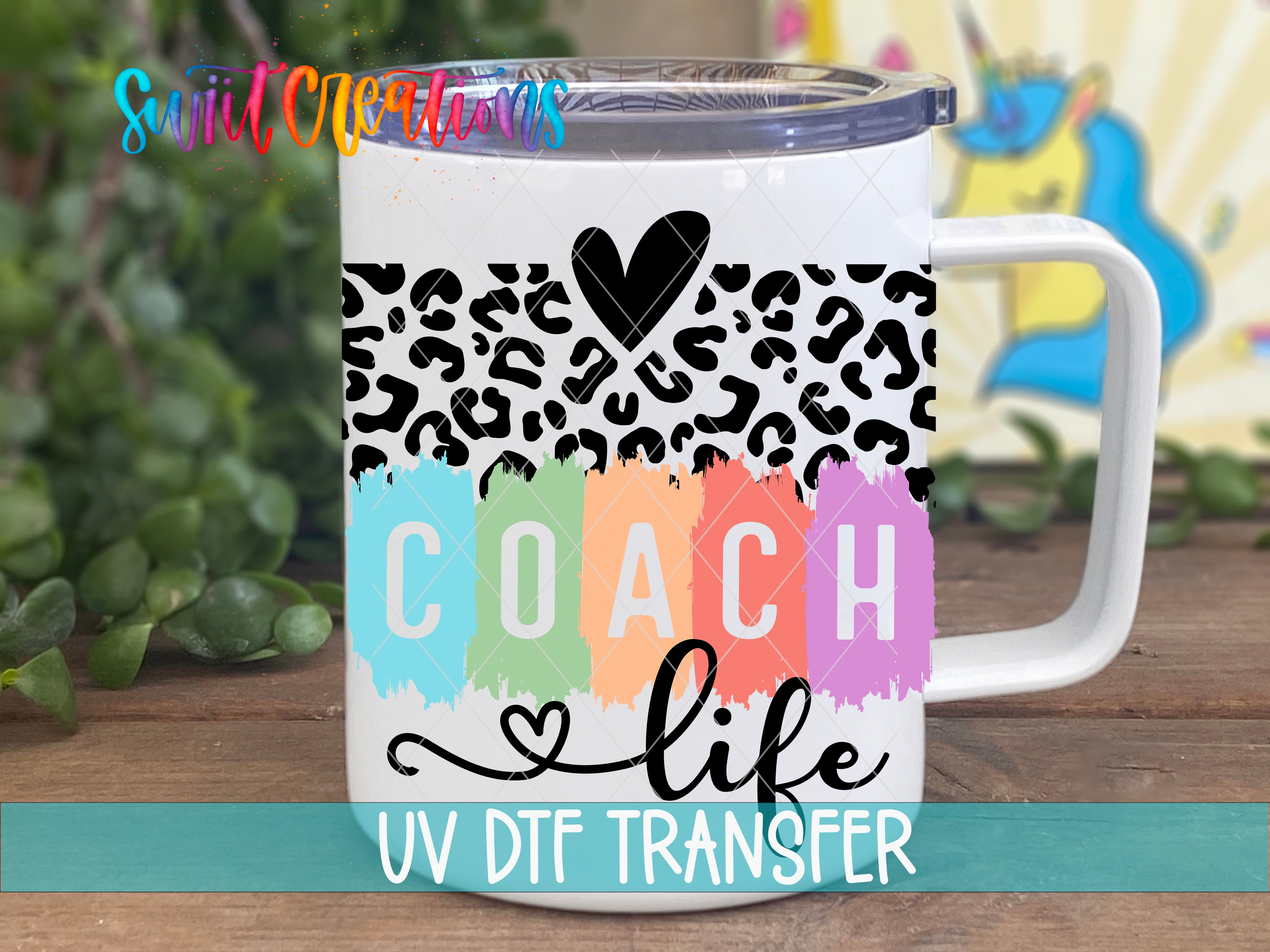 A white insulated mug with a leopard print design and the text "COACH life UV Dtf Transfer" printed on it.