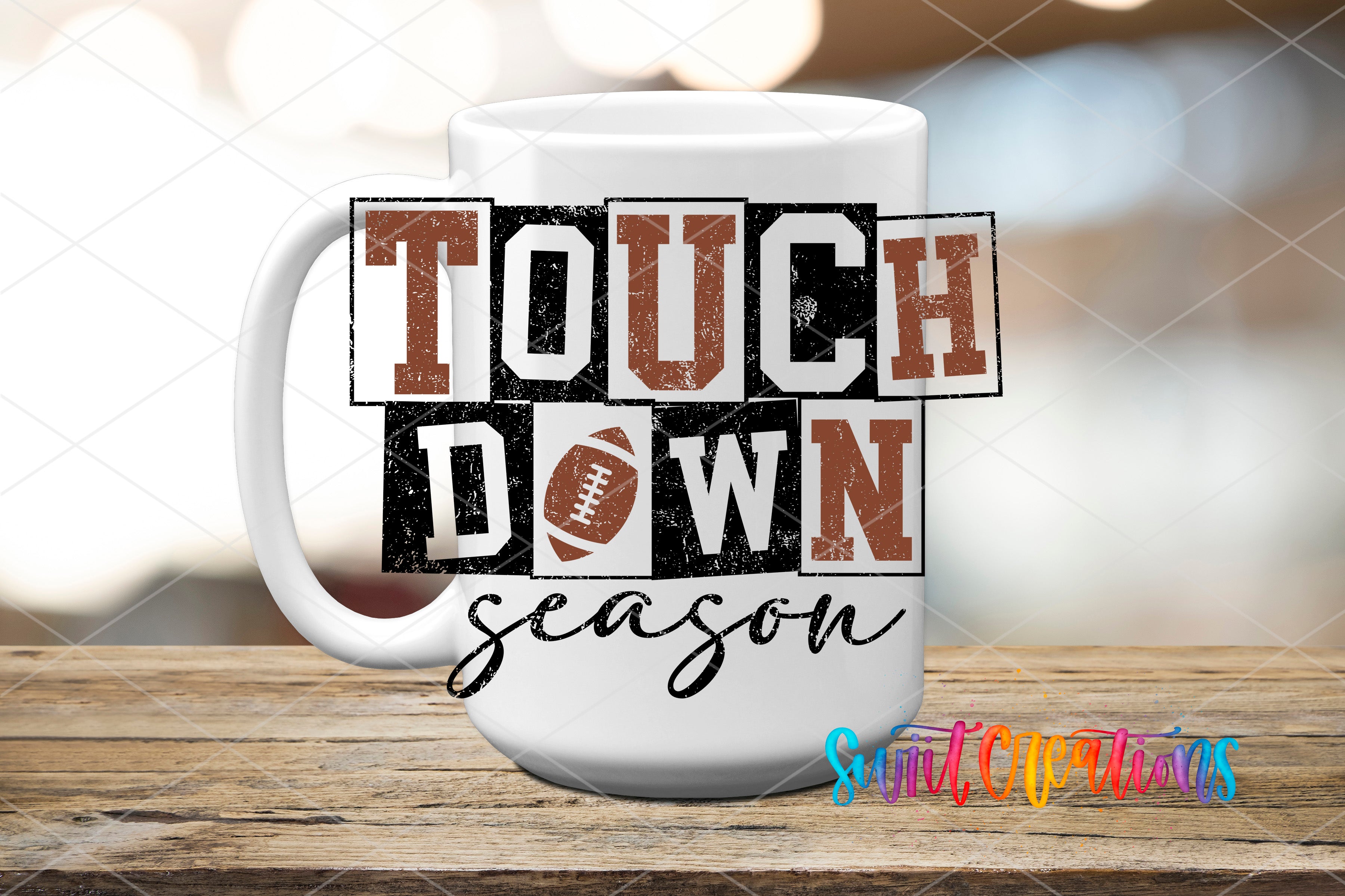 A white mug with the text "TOUCH DOWN season" printed on it, along with a football graphic.
