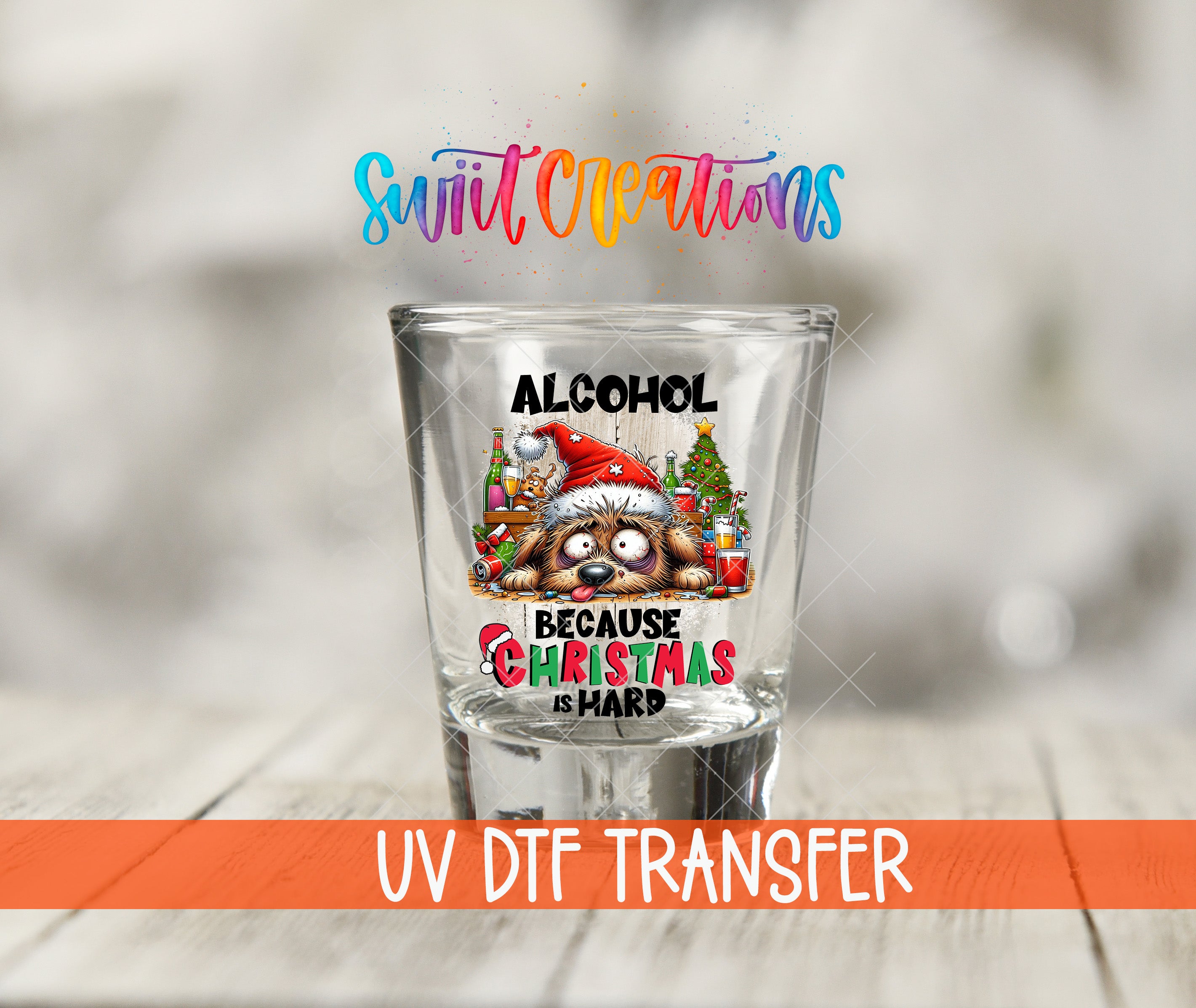 A shot glass with a Christmas-themed design and text, along with a UV DFT Transfer logo.