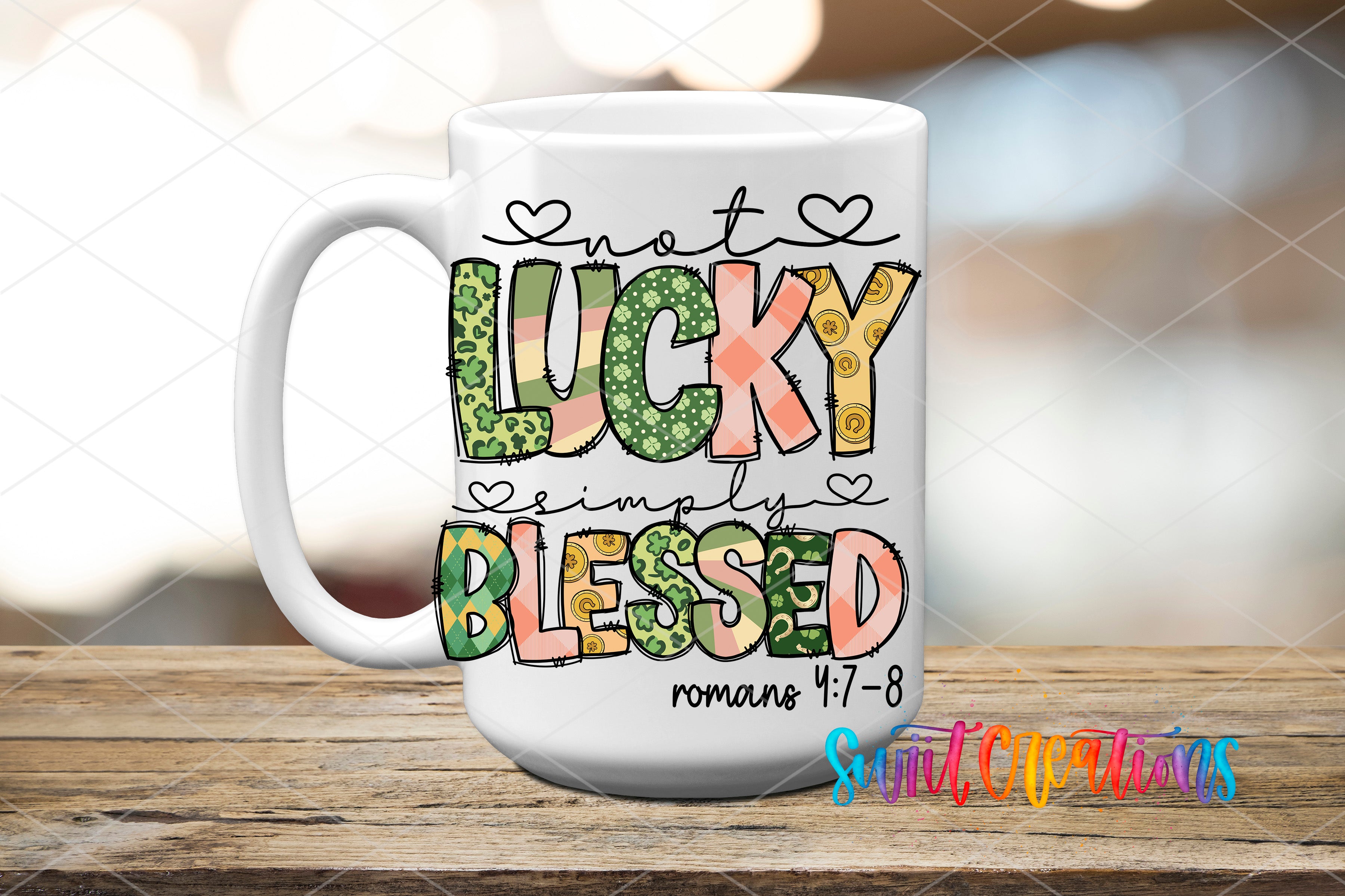 A white ceramic mug with colorful text and graphics on it, placed on a wooden surface.