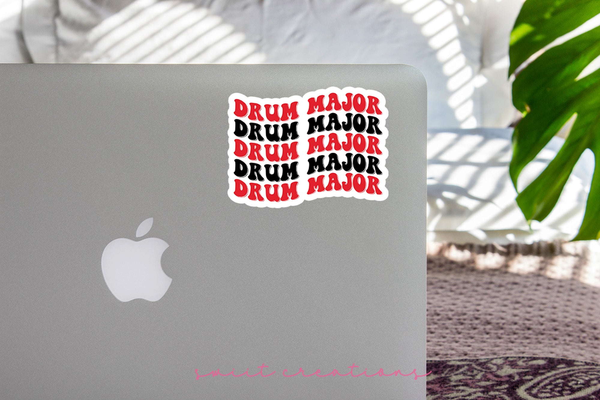 a laptop with stickers on it sitting on a table