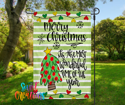 A festive Christmas-themed flag with a green and white striped background, a decorated Christmas tree, and various holiday-themed elements such as snowflakes and hearts.