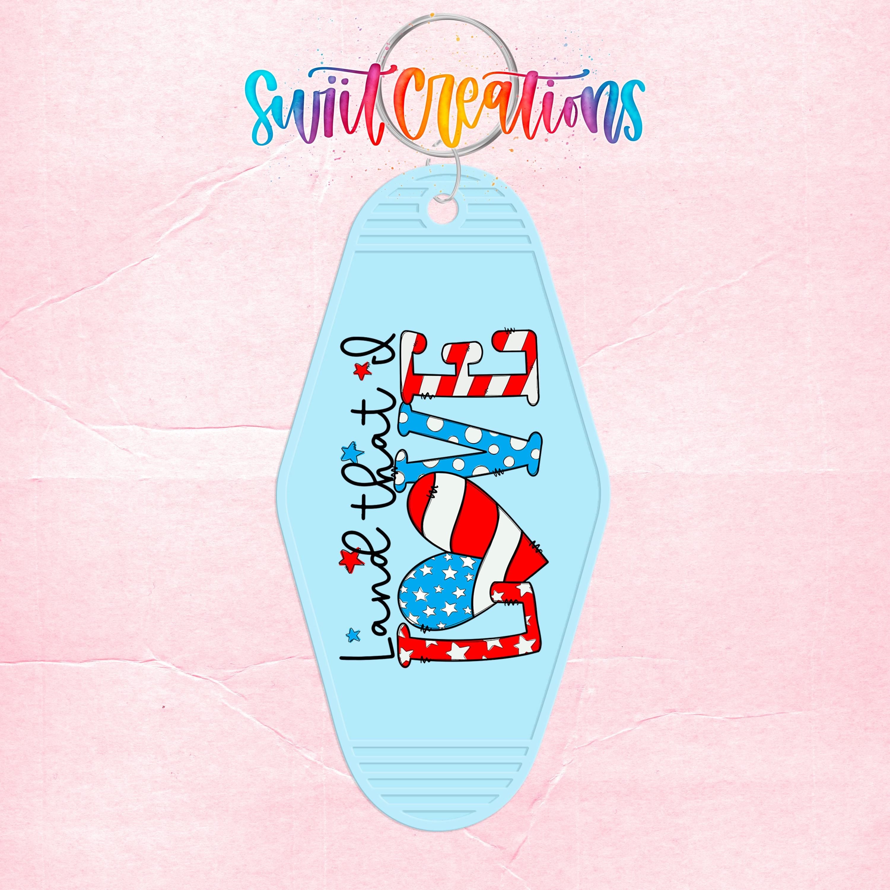 A keychain with a patriotic design featuring the text "Land that I love" and an American flag pattern.