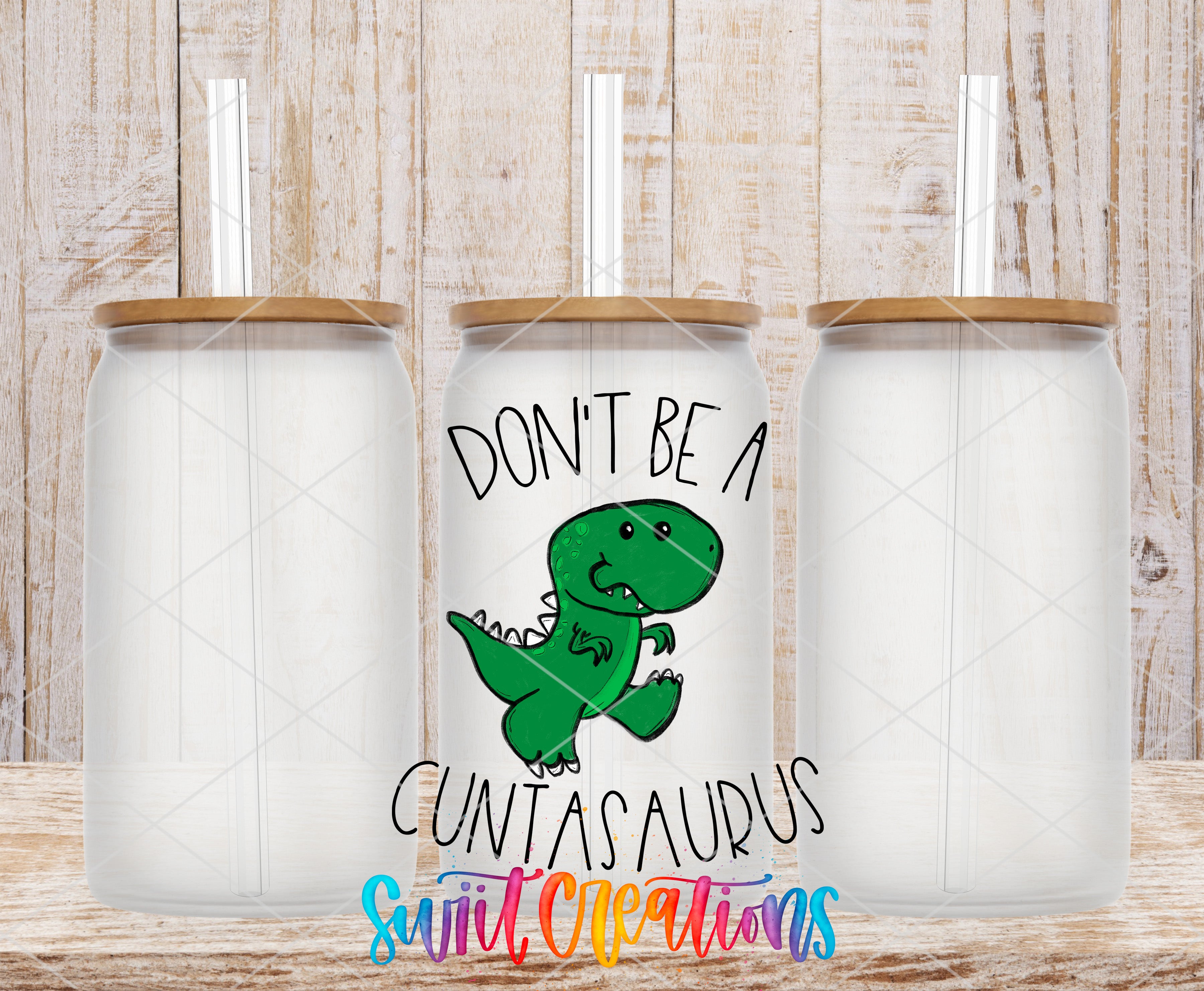 a white can with a cartoon dinosaur and the text "DON'T BE A CUNTAS AURUS" printed on it.