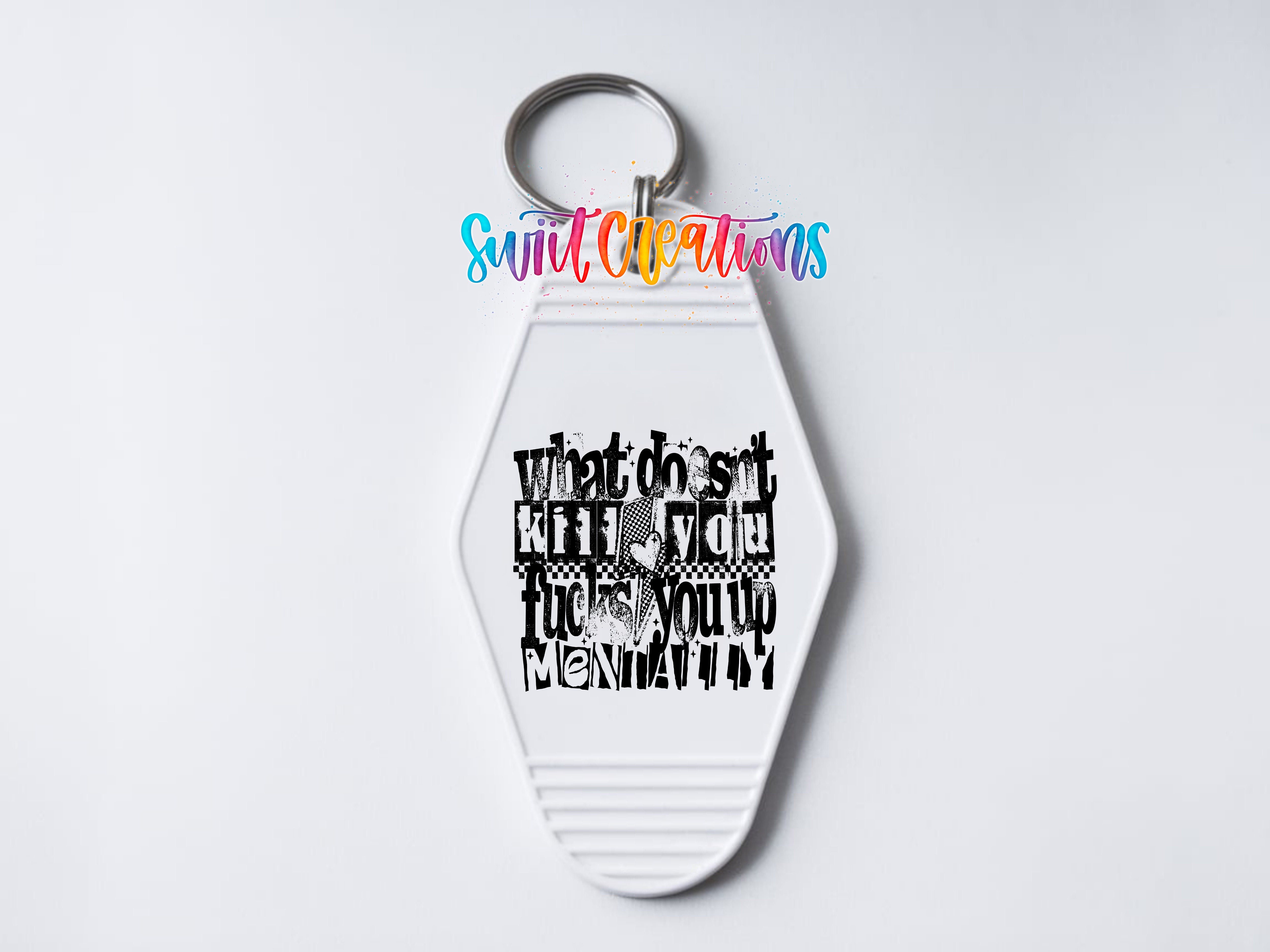 A white keychain with a keyring and a colorful logo above it. The logo contains the text "Sunlit Creations" and "What does it say when you're up to your neck in mud?"