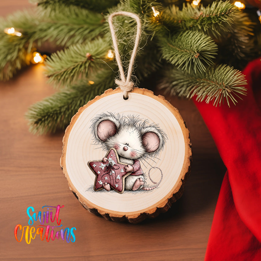 A wooden ornament featuring a cartoon mouse holding a star, hanging on a Christmas tree.