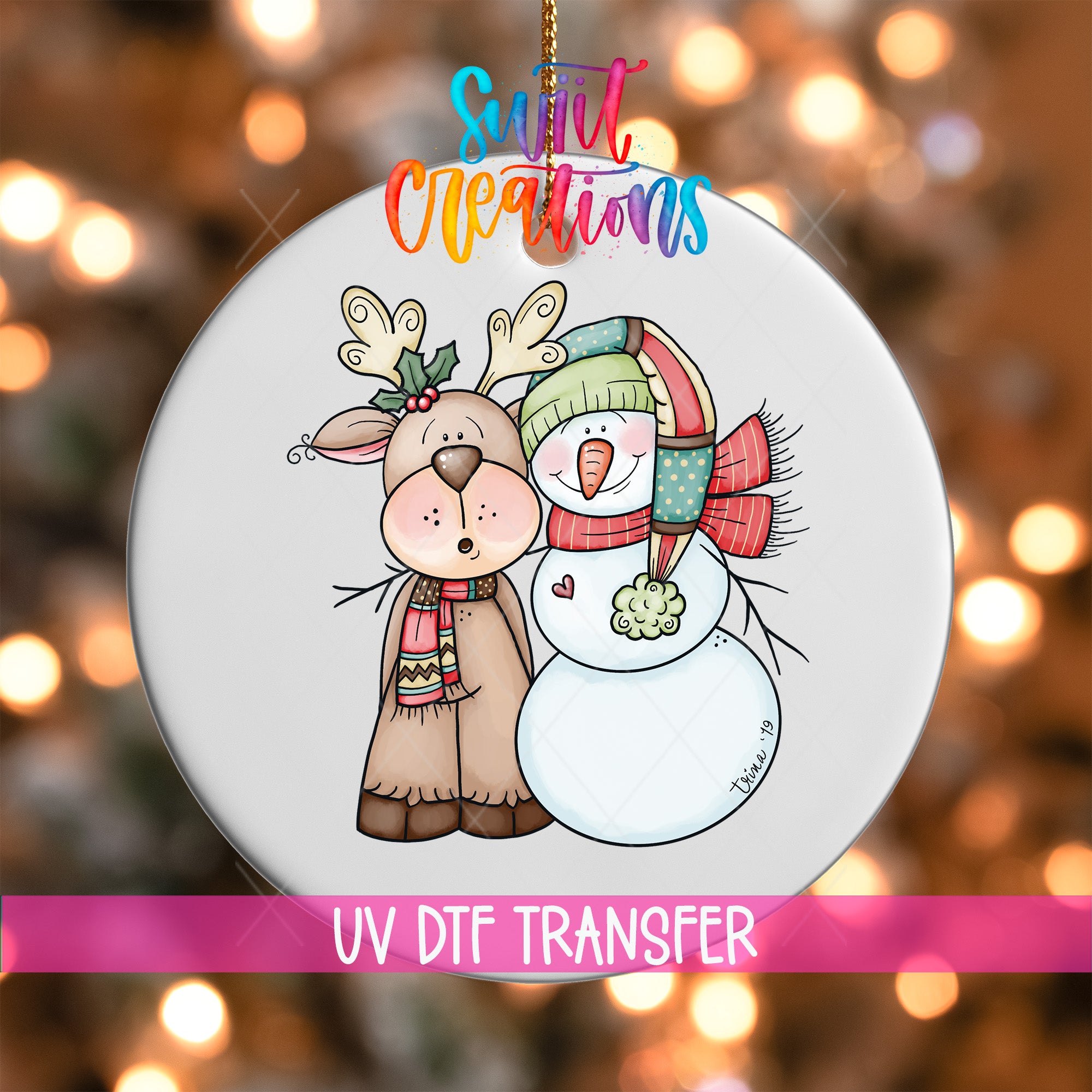 A white ornament with a deer and a snowman, both wearing festive winter attire, is displayed against a background of colorful lights.