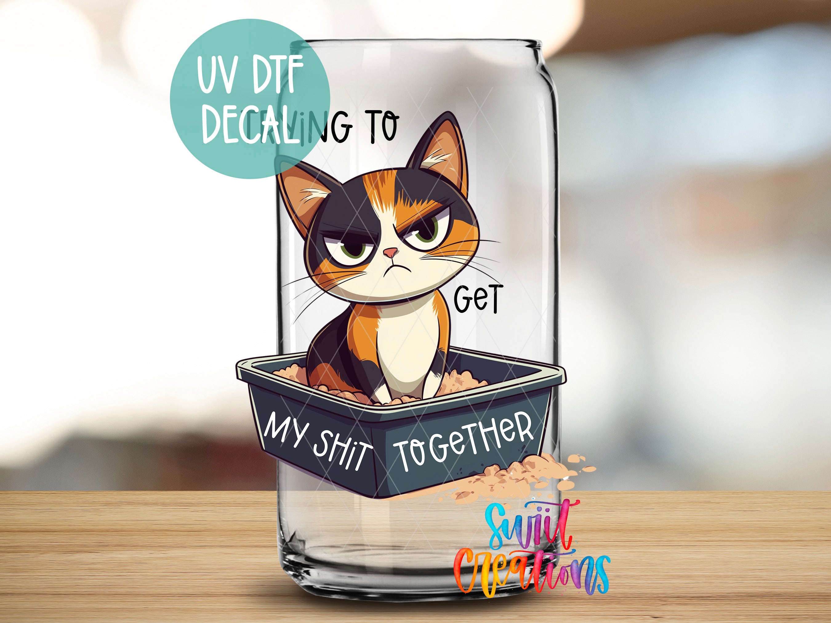 a glass with a picture of a cat inside of it