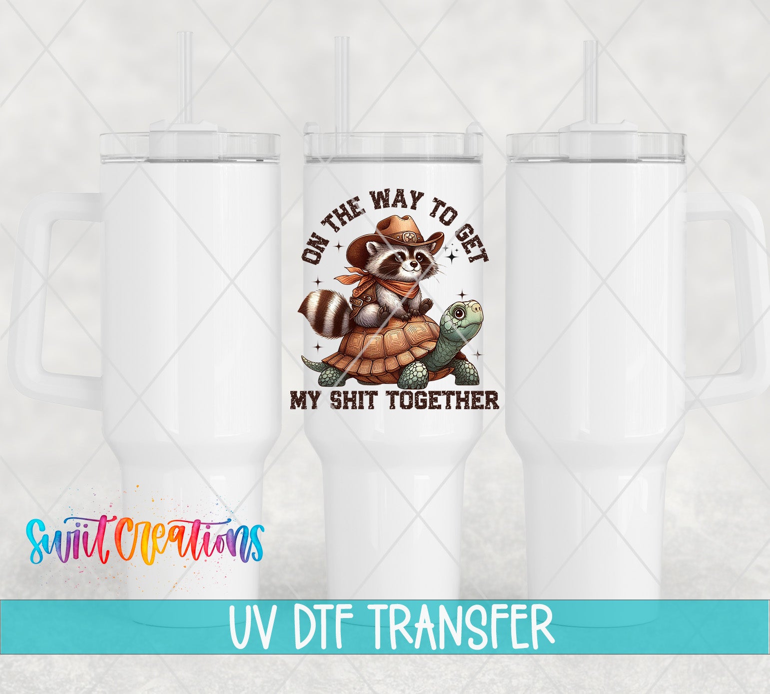a white ceramic mug with a printed design on it, including a raccoon and a turtle. The mug has a straw and the text "ON THE WAY TO GET MY SHIT TOGETHER" printed on it.