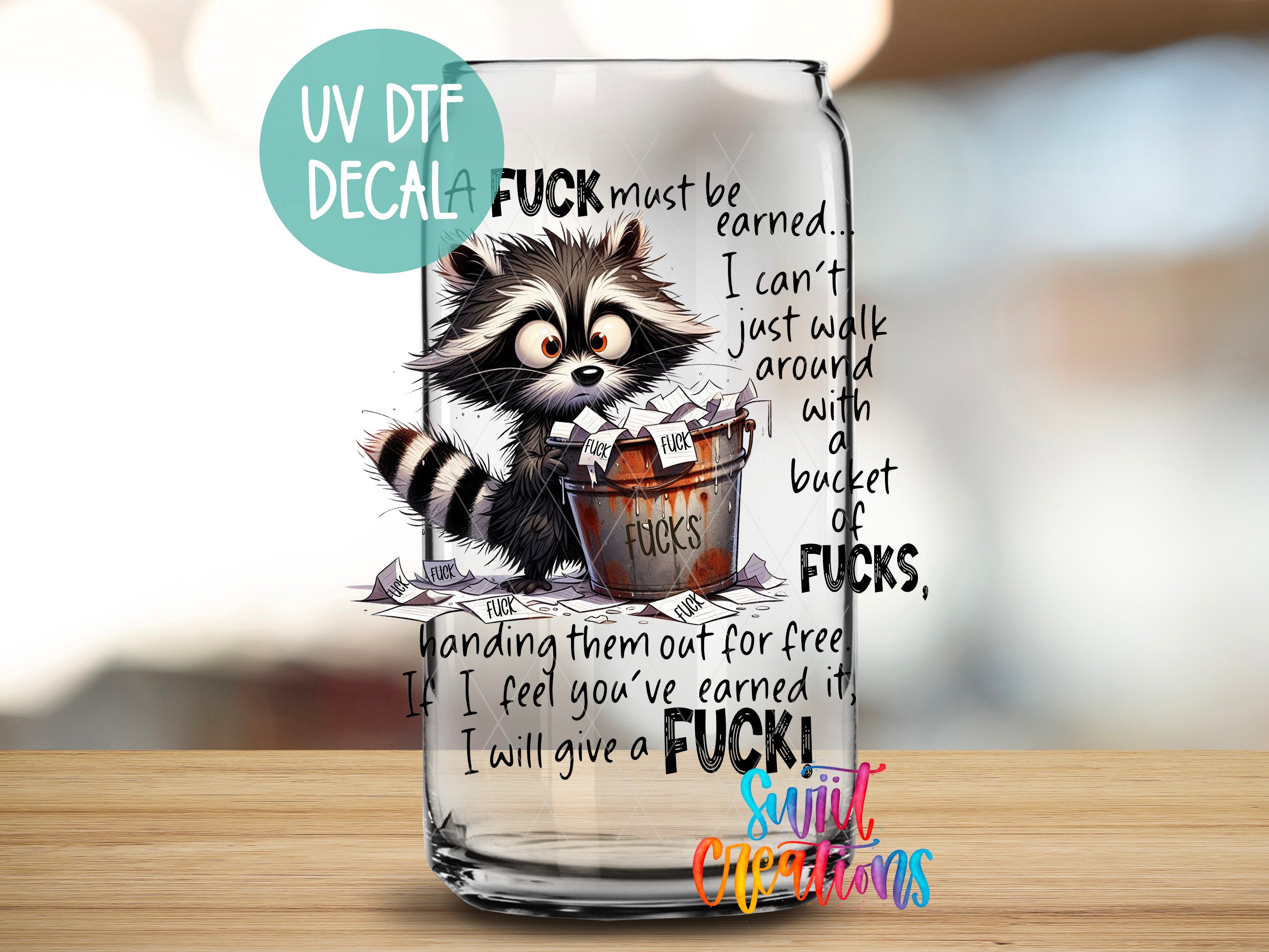 A glass jar with a raccoon and text printed on it, along with a humorous message about earning money and being mean.