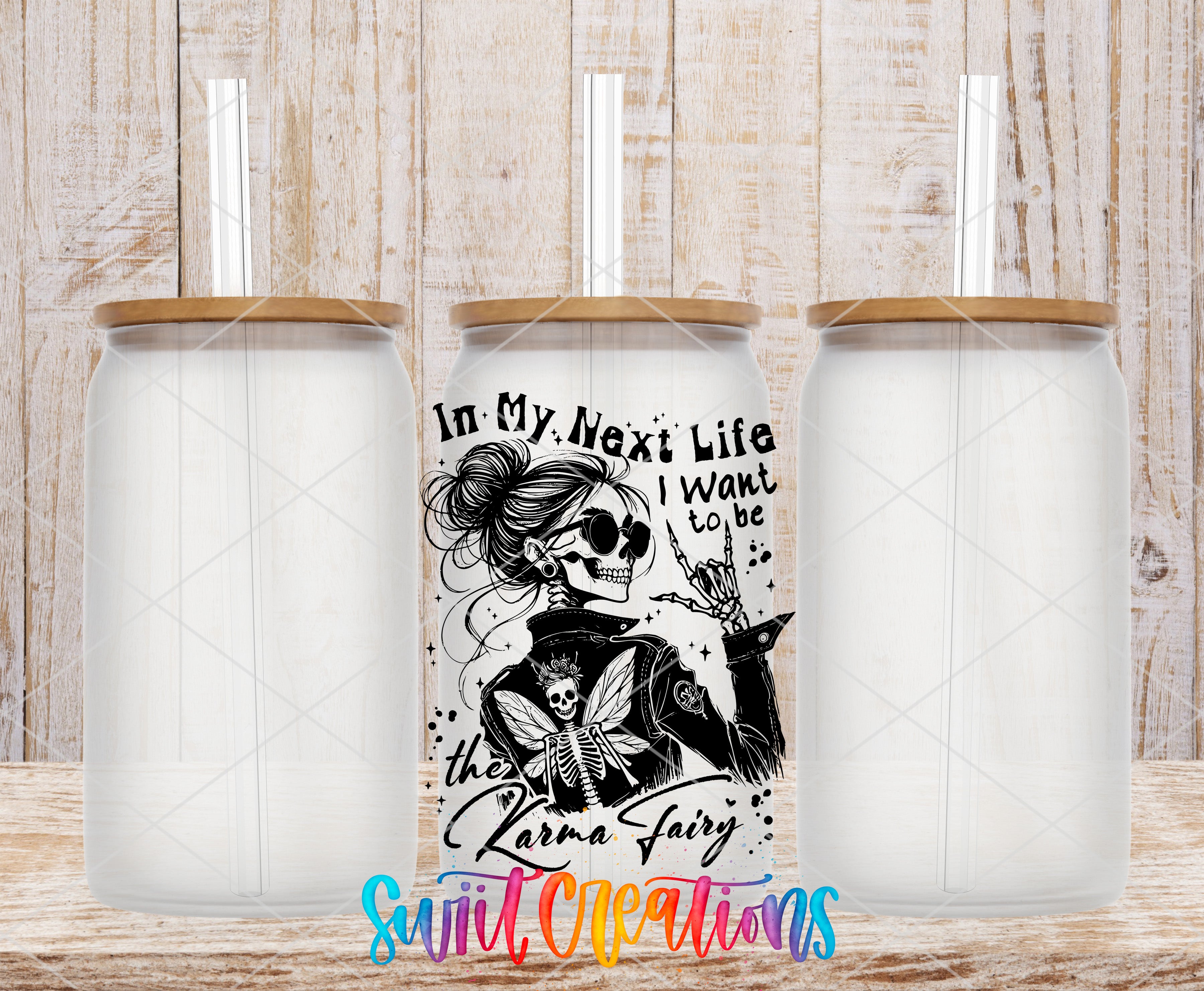 A collage of three glass jars with straws, each featuring a unique design and text. The central jar has a skull and wings design, while the other two jars have a floral design. The text on the central jar reads "In My Next Life I Want to Be the Zara Fairy".