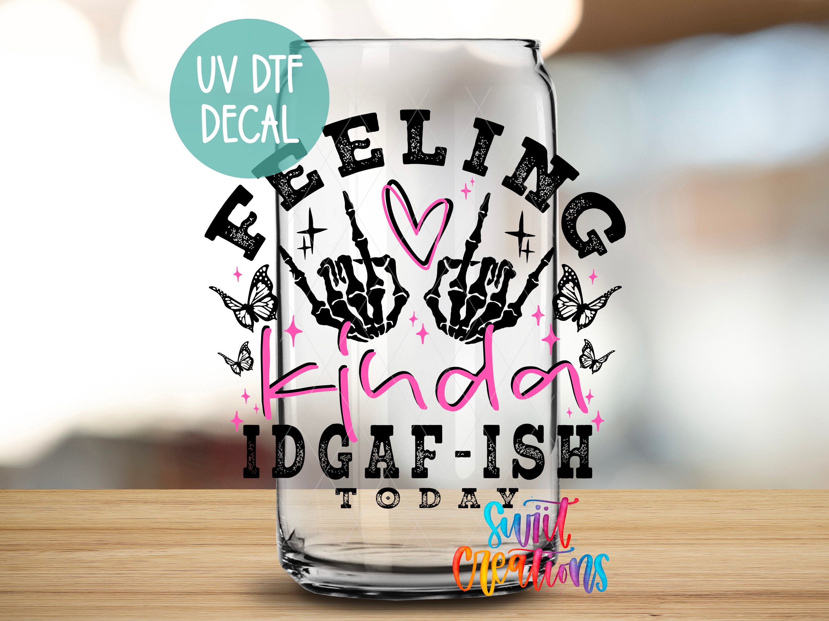 a glass with a hand drawn design on it