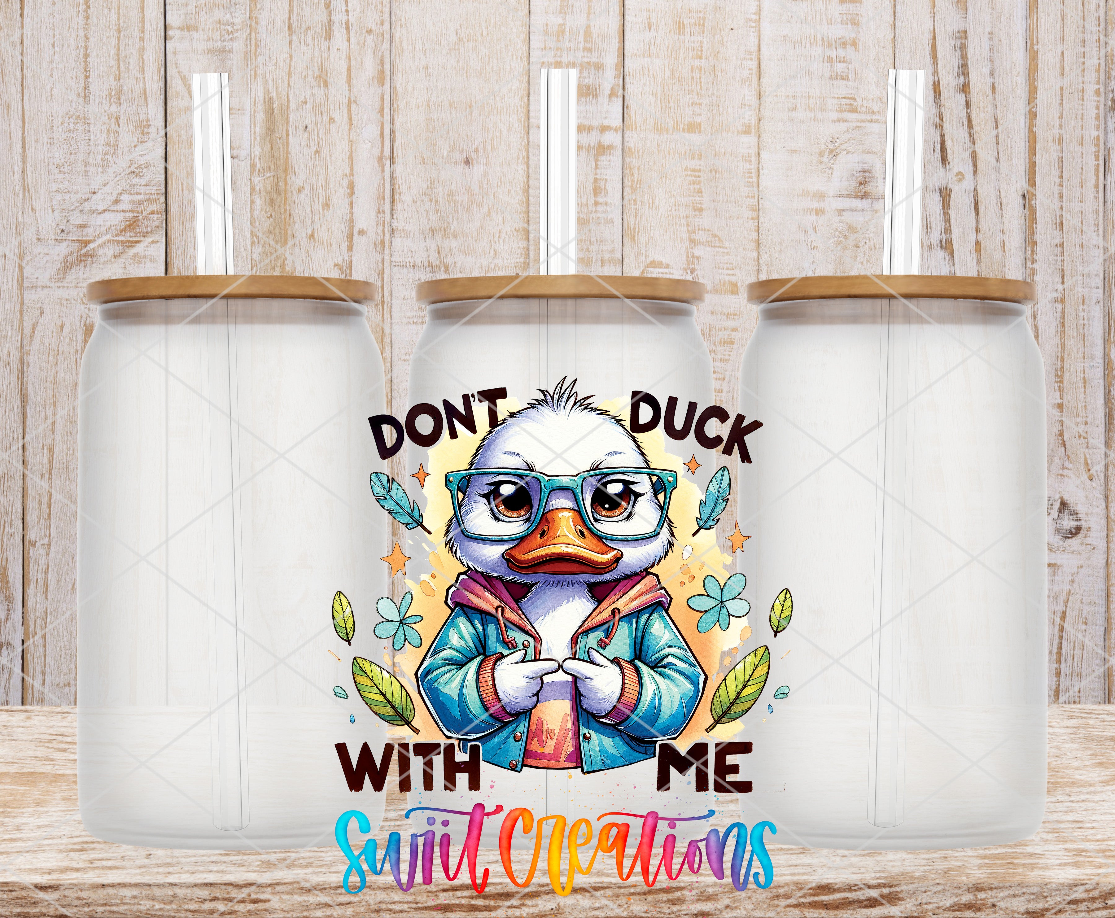 a cartoon duck wearing glasses and a jacket, with the text "DON'T DUCK WITH ME" and "Suit Creations" written below it.