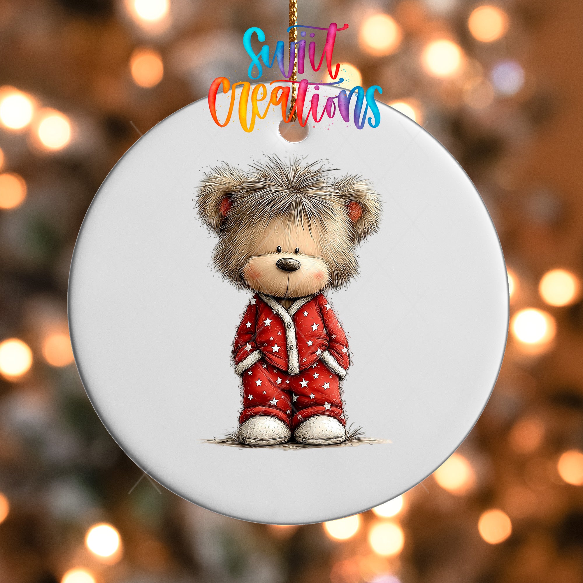 A white ornament featuring a cute teddy bear wearing a red outfit with white stars.
