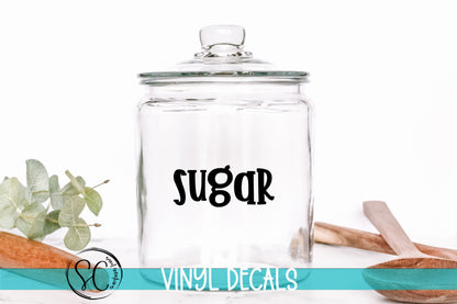 a glass jar with the word sugar on it