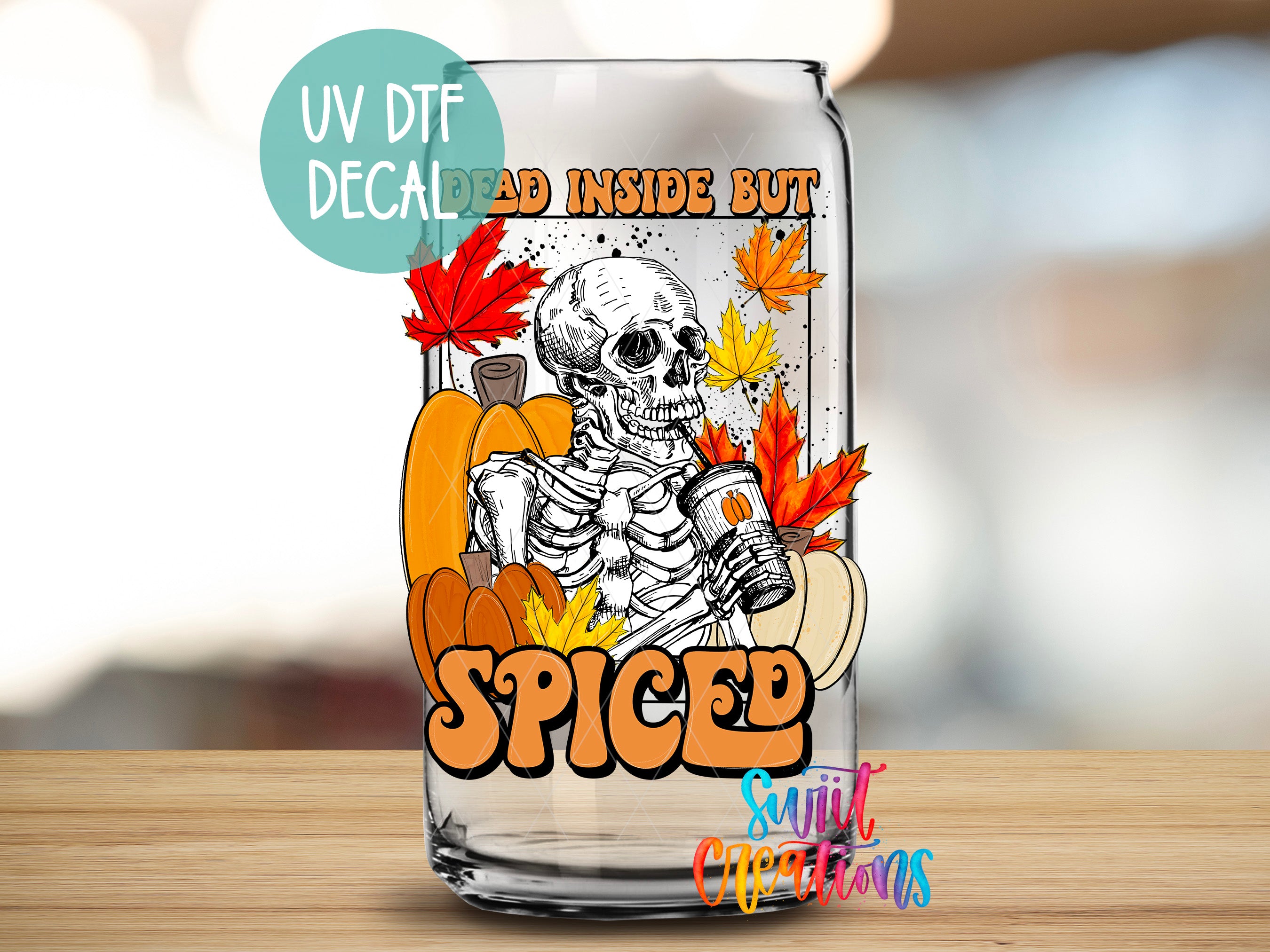 a glass can with a skeleton and autumn leaves, along with the text "SPICED" and "Dead inside but" printed on it.