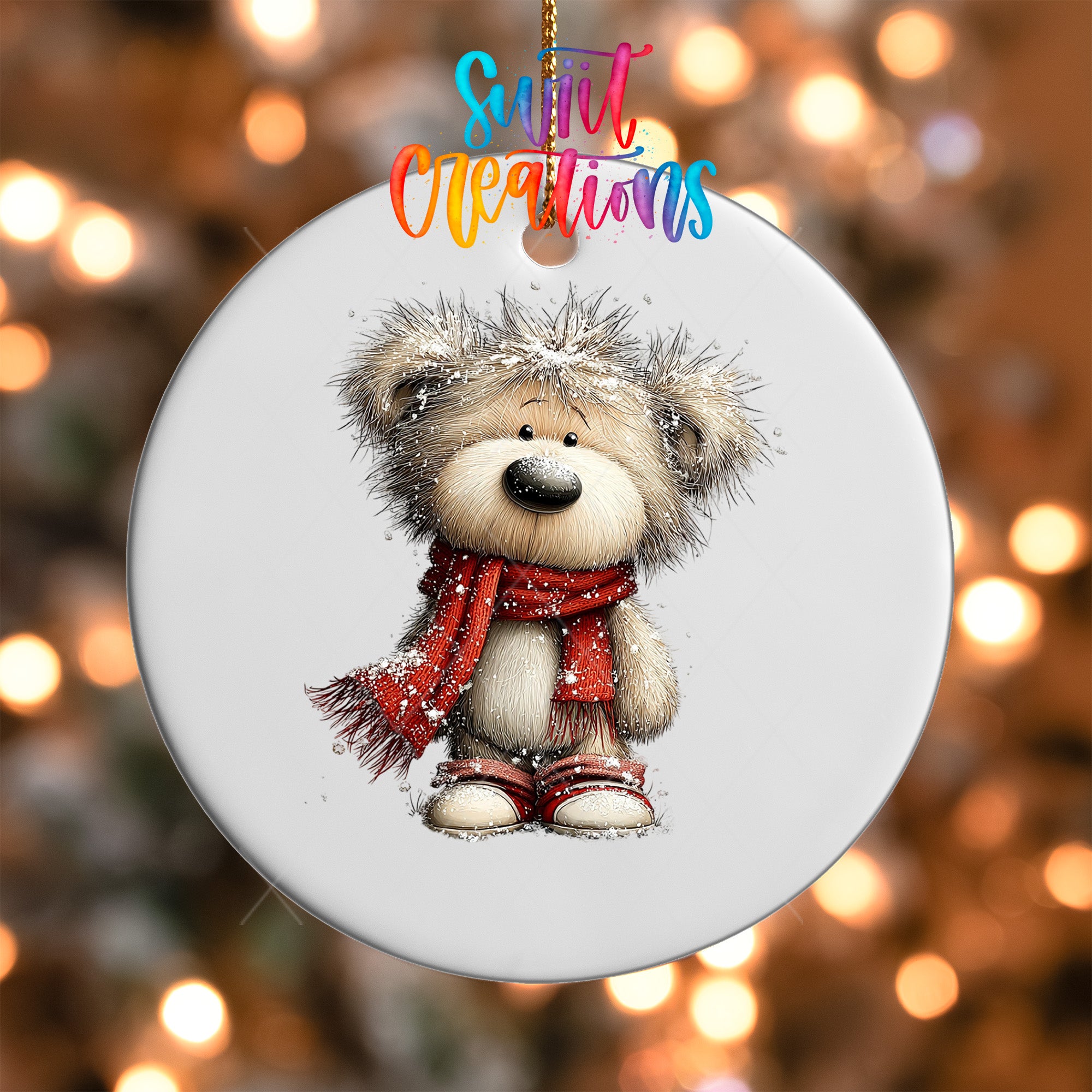 A white ornament featuring a cute teddy bear wearing a red scarf and standing in front of a blurred background with colorful lights.