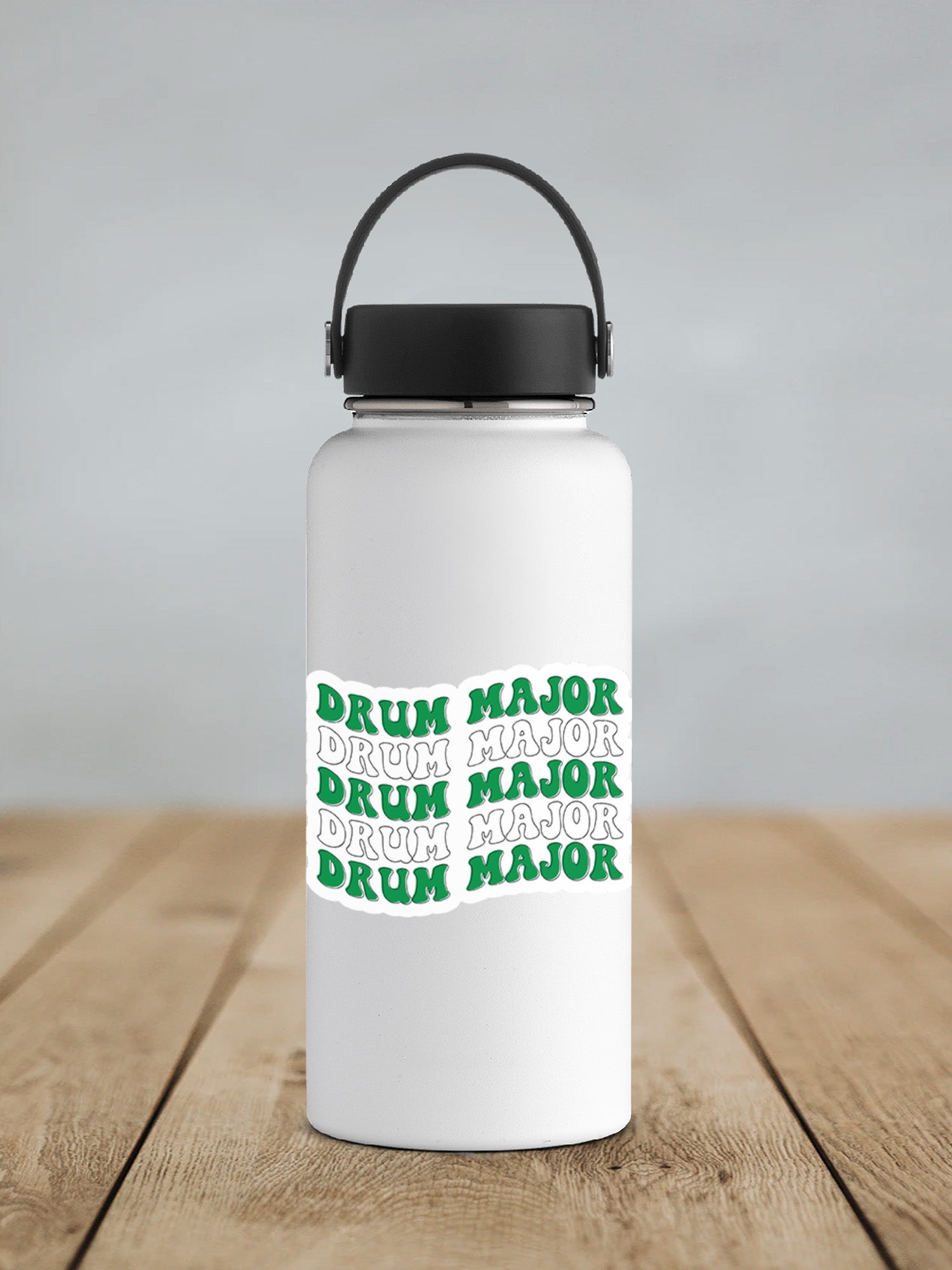 a white water bottle sitting on top of a wooden table