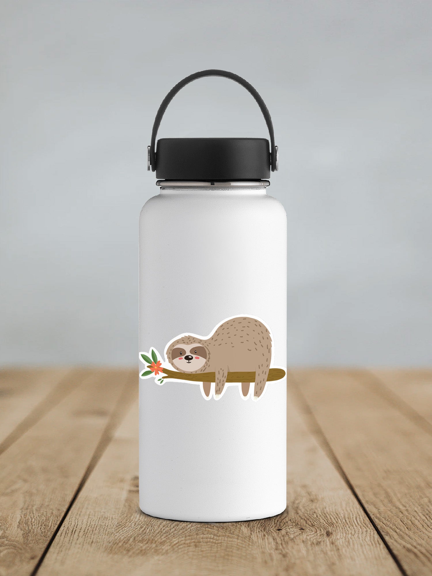 a white water bottle with a slotty on a branch