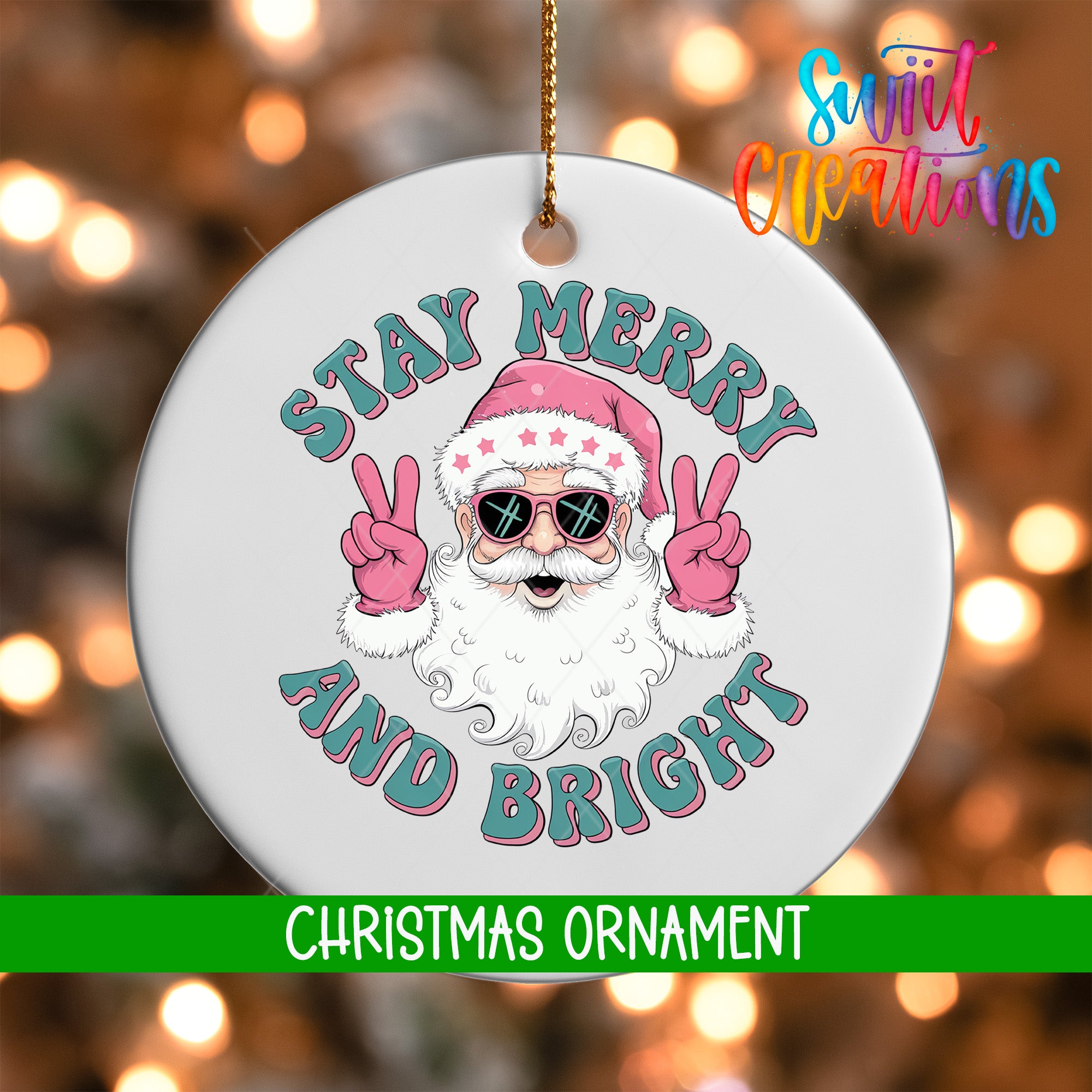 A white Christmas ornament with a Santa Claus face and the text "STAY MERRY AND BRIGHT" in pink and blue colors.