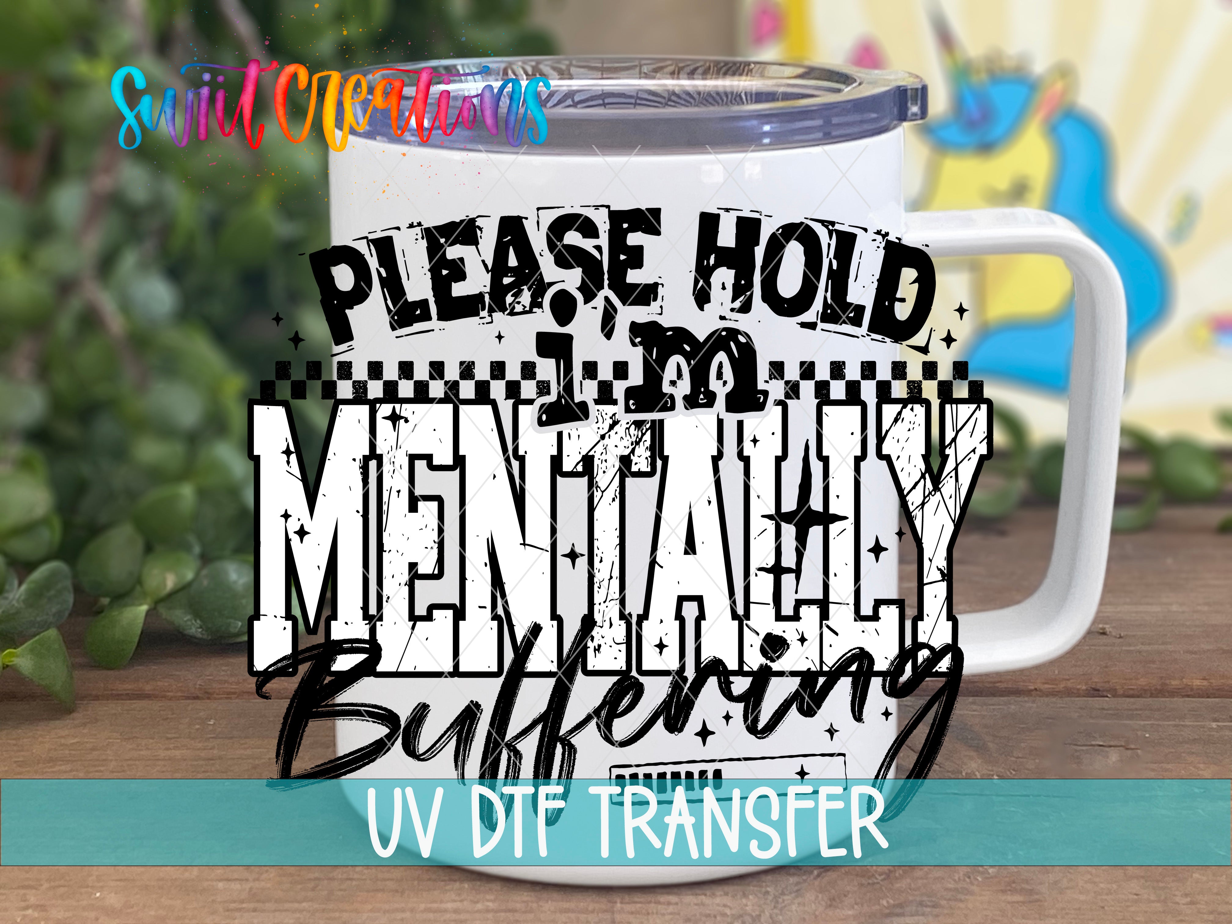 a white mug with a printed text design on it, placed on a wooden surface.