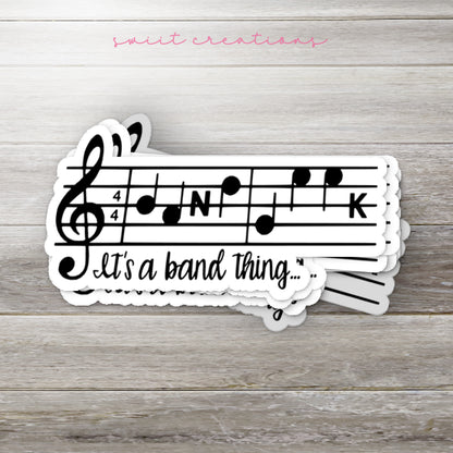 a pair of stickers that say it's a band thing