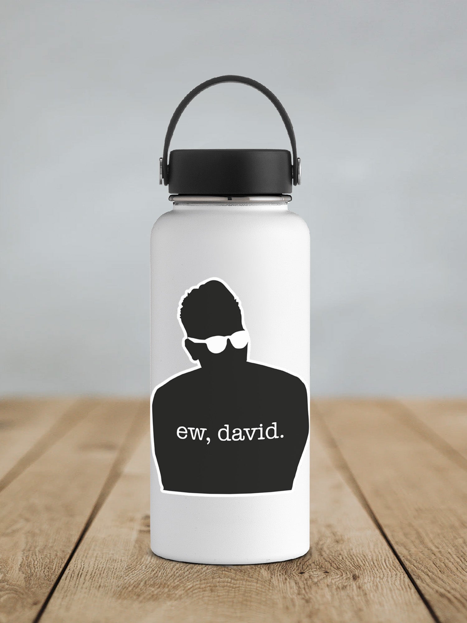 a water bottle with a picture of a man wearing sunglasses