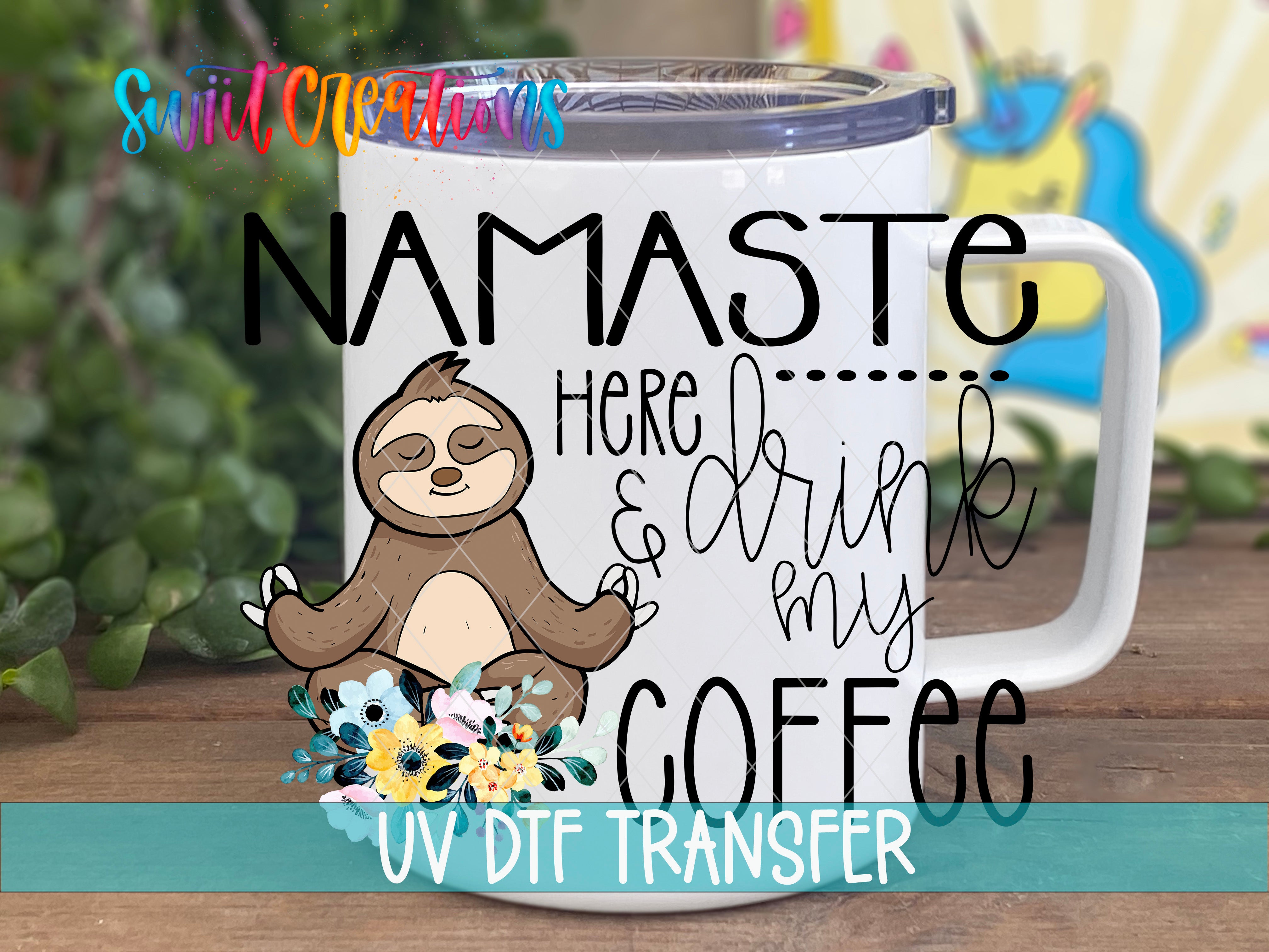 A mug with a sloth illustration and text that says "NAMASTE HERE... DRINK MY COFFEE"
