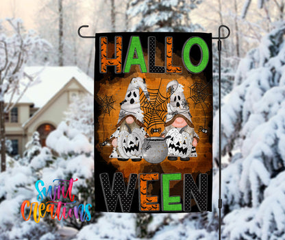 A Halloween-themed garden flag with the text "HALLO WEN" displayed prominently. The flag features illustrations of two gnomes and a spider, along with the text "HALLO WEN" in a stylized font.