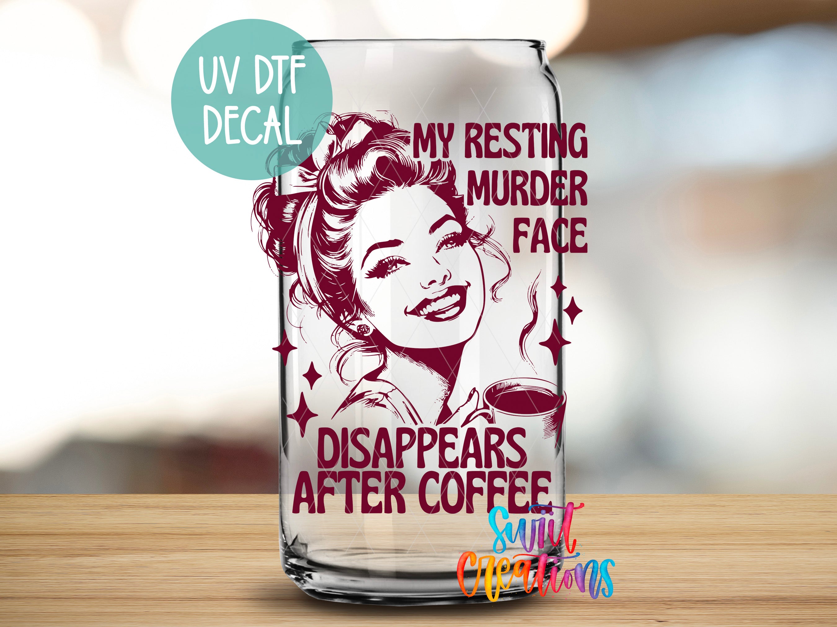 a glass can with a printed design on it, including a woman's face and text.