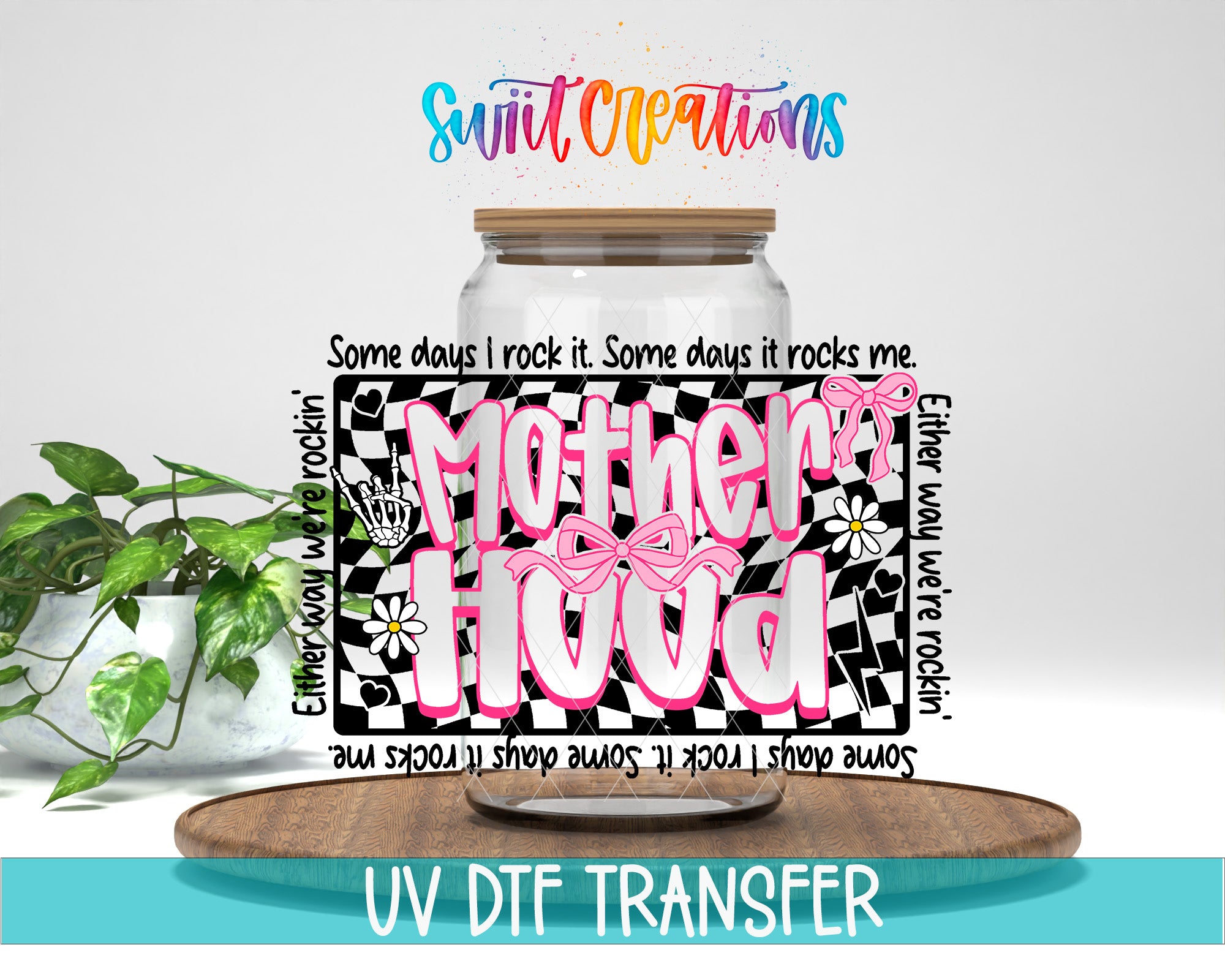 a glass jar with a colorful design and text, placed on a wooden surface.