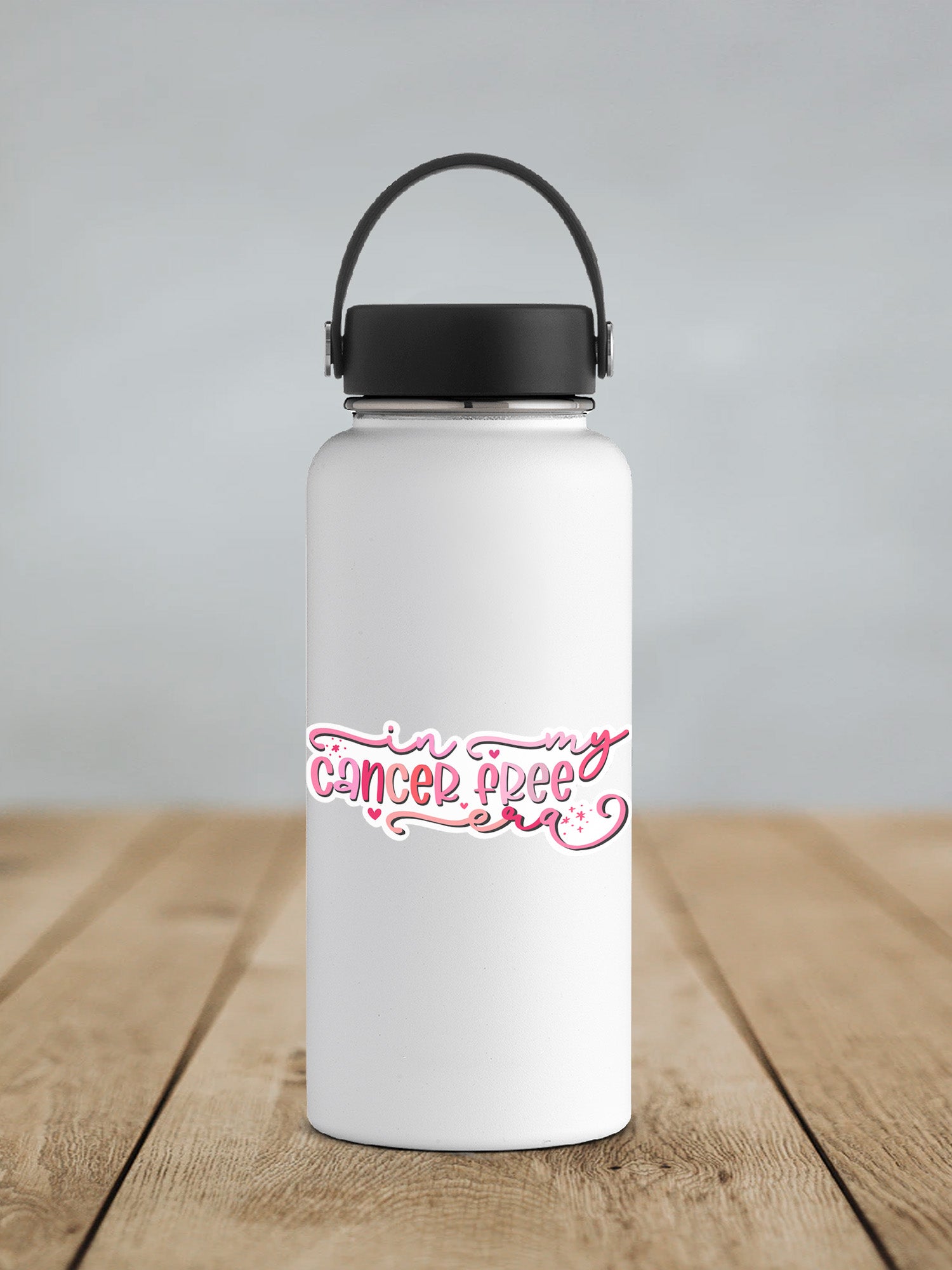 a white water bottle sitting on top of a wooden table