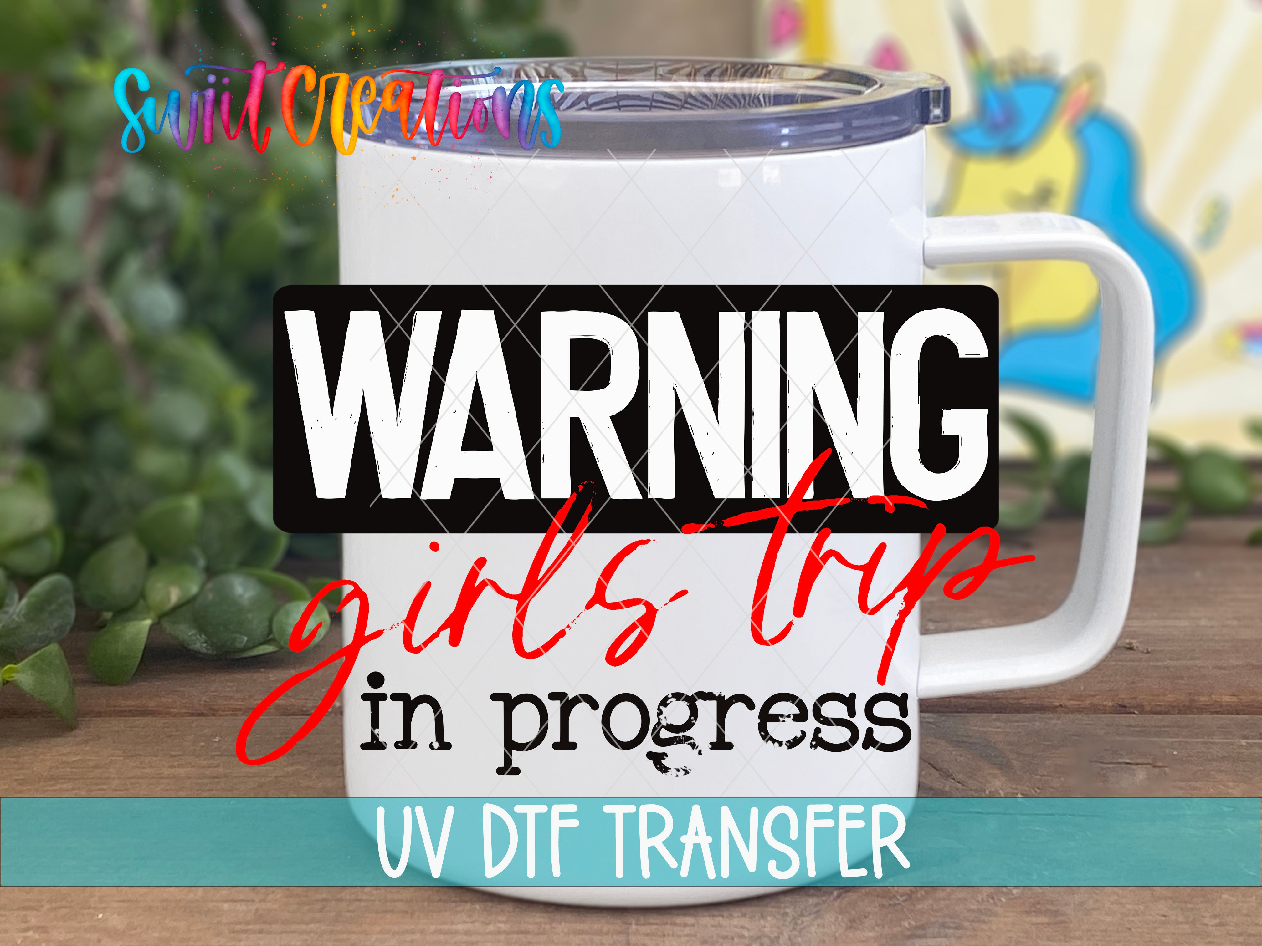 A white mug with a clear lid and a warning label on it, along with some text and a colorful background.