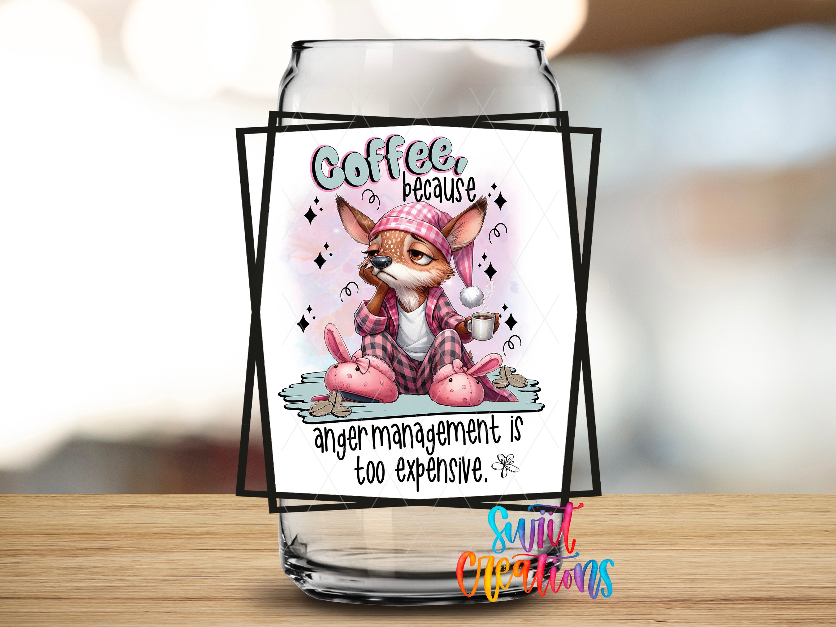 a glass jar with a cartoon image of a cat wearing a hat and holding a cup, along with the text "Coffee because anger management is too expensive."